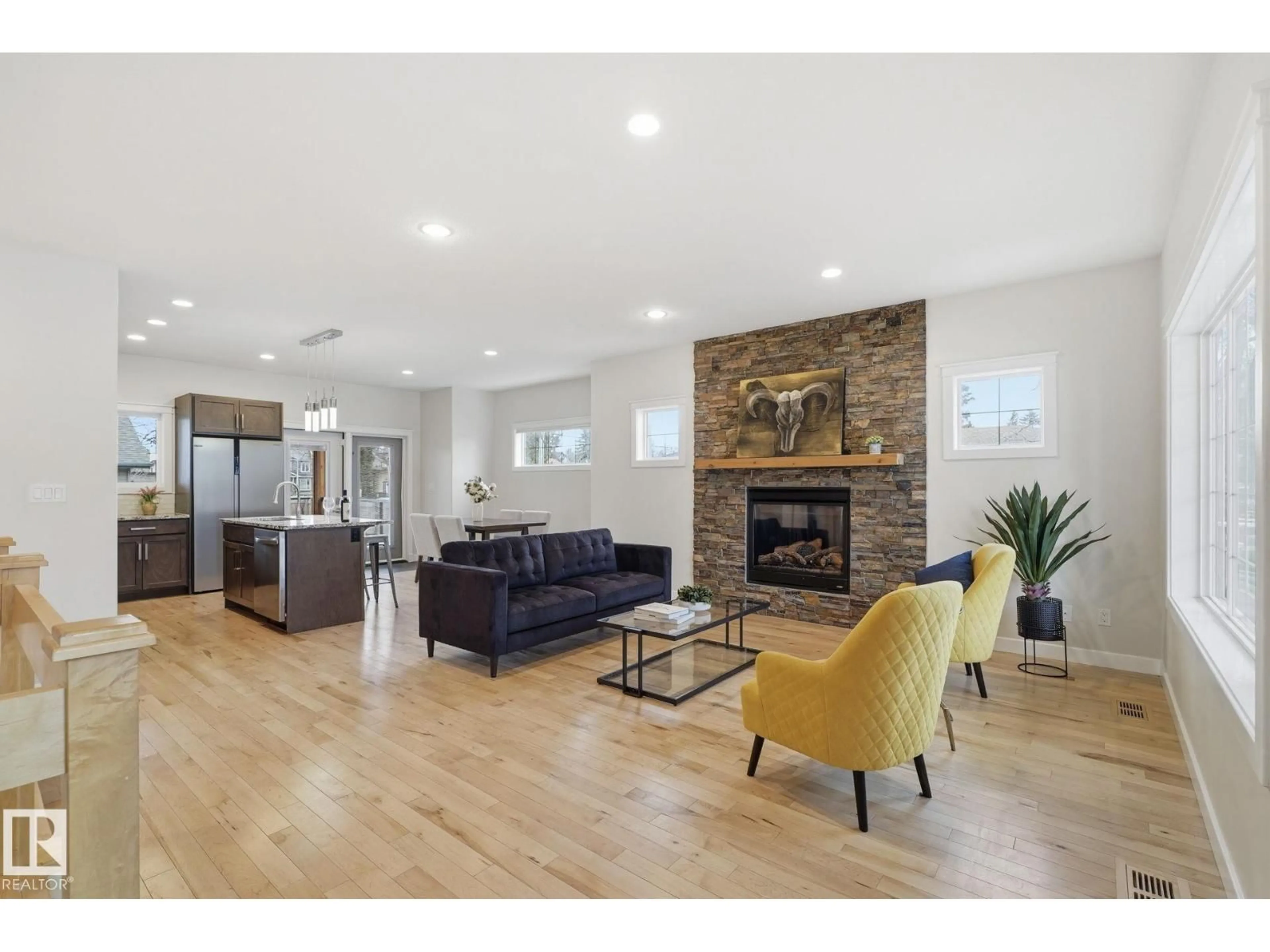 Living room with furniture, wood/laminate floor for 8704 75 AV, Edmonton Alberta T6C0H2