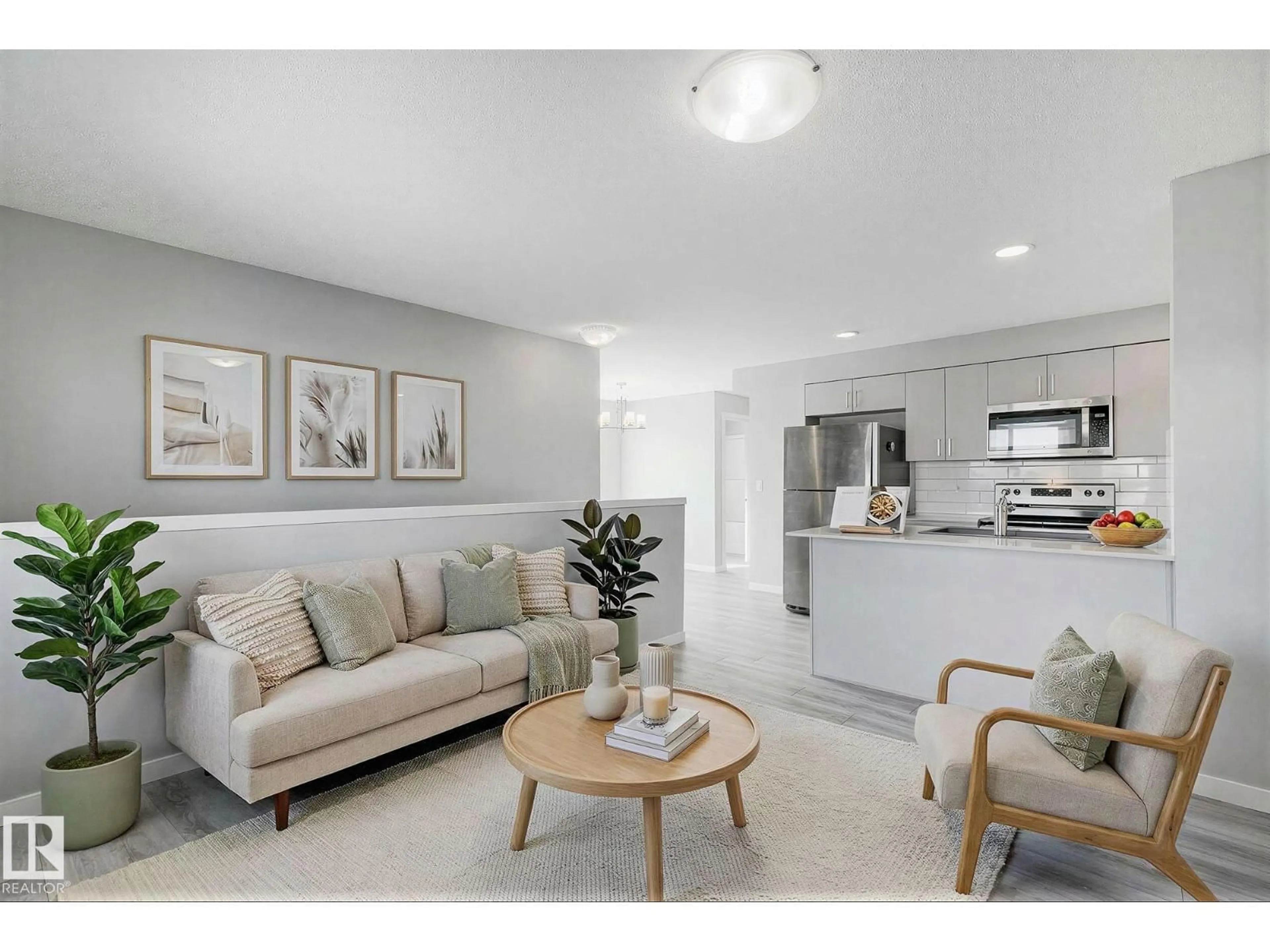 Living room with furniture, ceramic/tile floor for 1530 - 20 TAMARACK BV, Edmonton Alberta T6T2E6