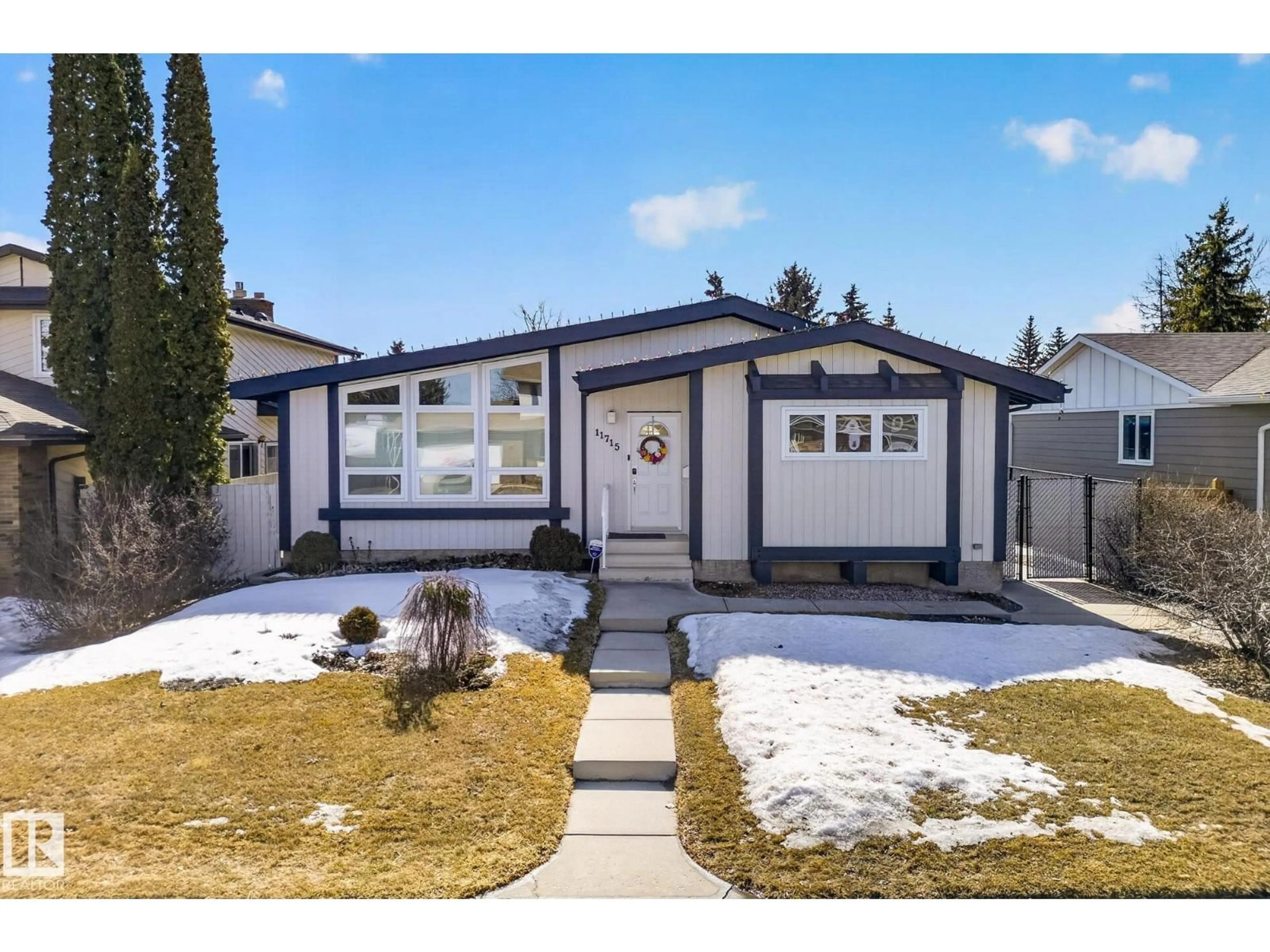 Home with vinyl exterior material, street for 11715 28 AV, Edmonton Alberta T6J3P1