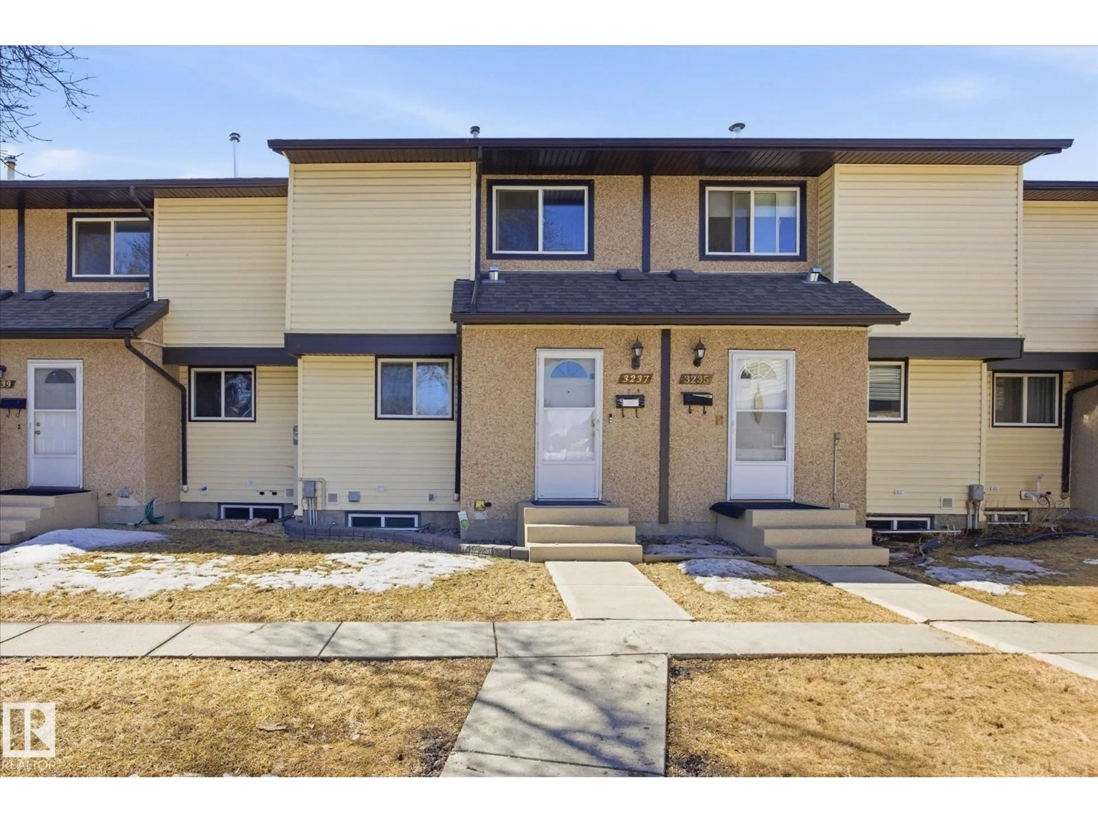 Home with vinyl exterior material, street for 3237 142 AV, Edmonton Alberta T5Y1H9