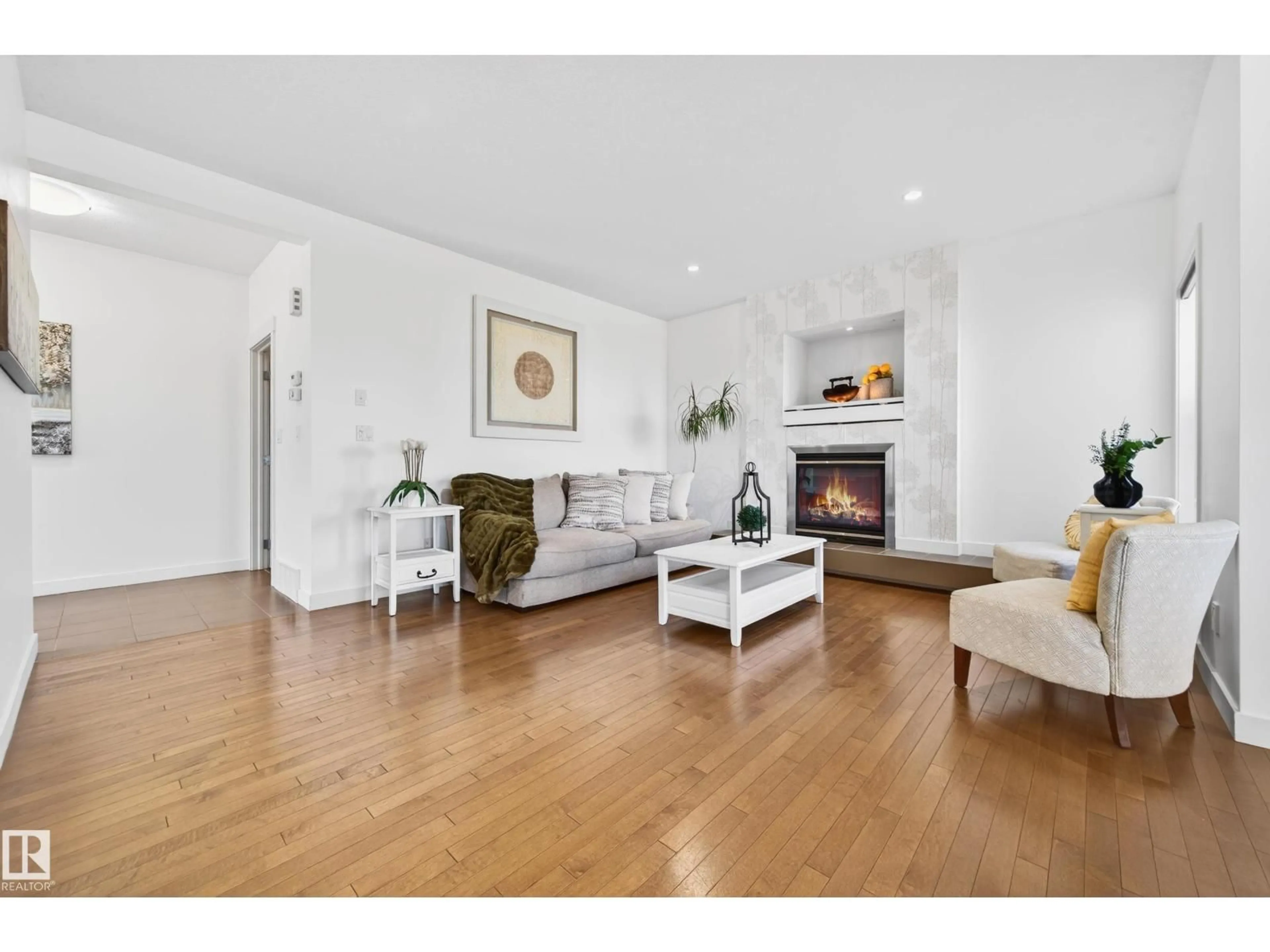 Living room with furniture, wood/laminate floor for PM NW - 1004 SECORD PROMENADE, Edmonton Alberta T5T4A4