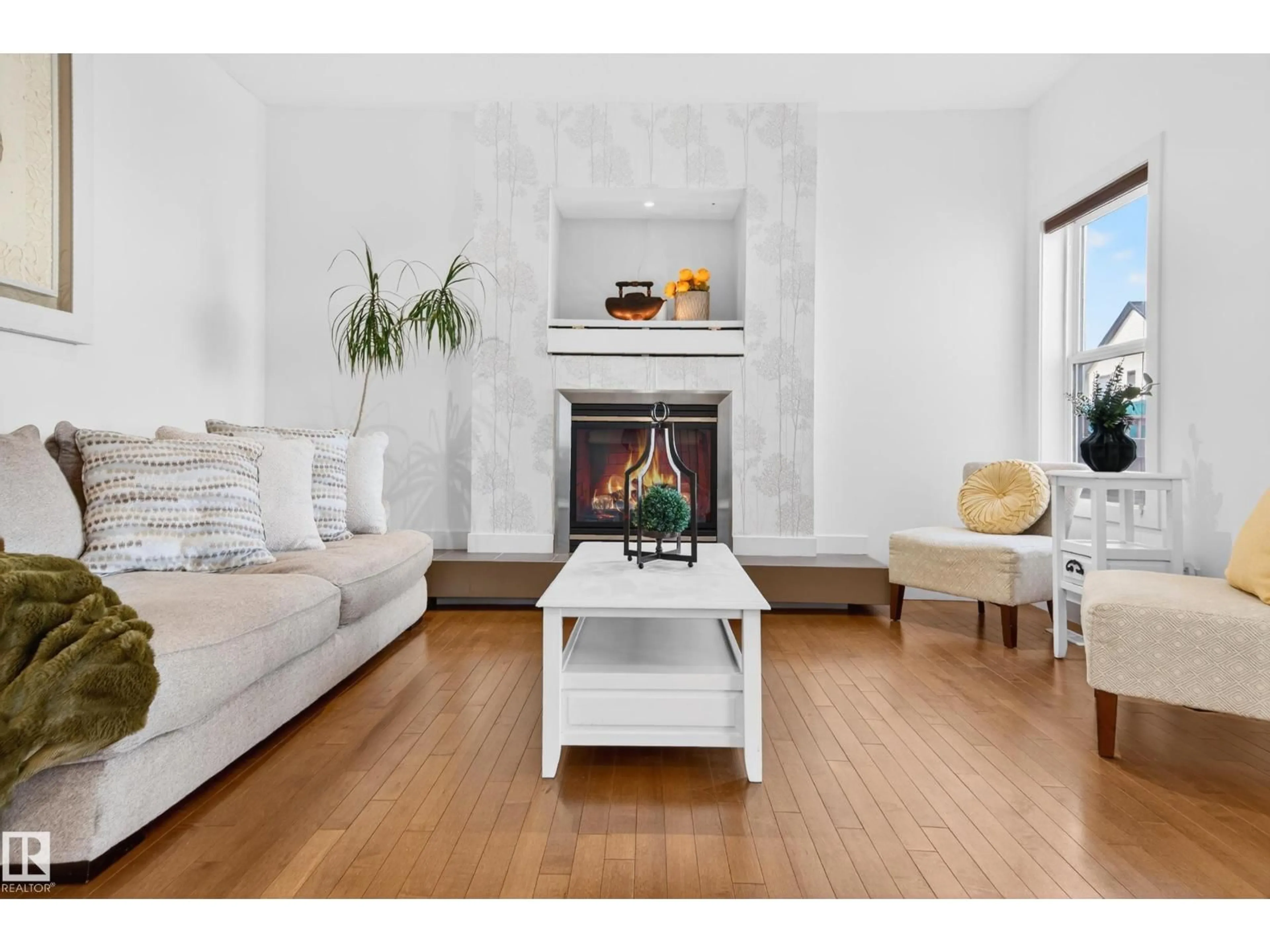 Living room with furniture, wood/laminate floor for PM NW - 1004 SECORD PROMENADE, Edmonton Alberta T5T4A4