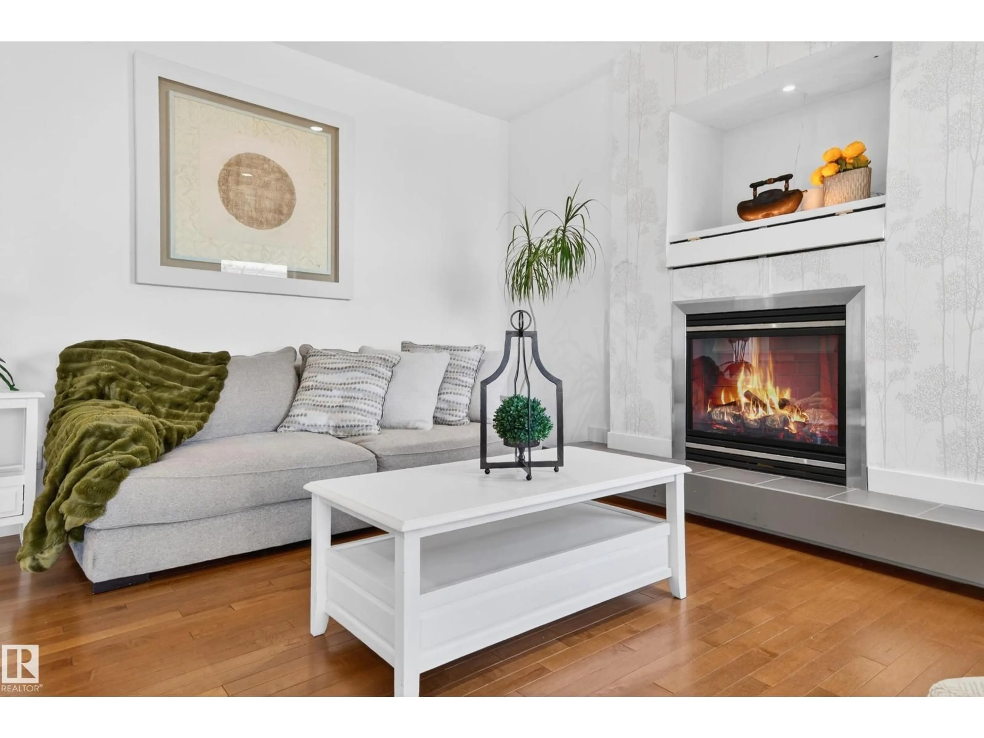 Living room with furniture, wood/laminate floor for PM NW - 1004 SECORD PROMENADE, Edmonton Alberta T5T4A4