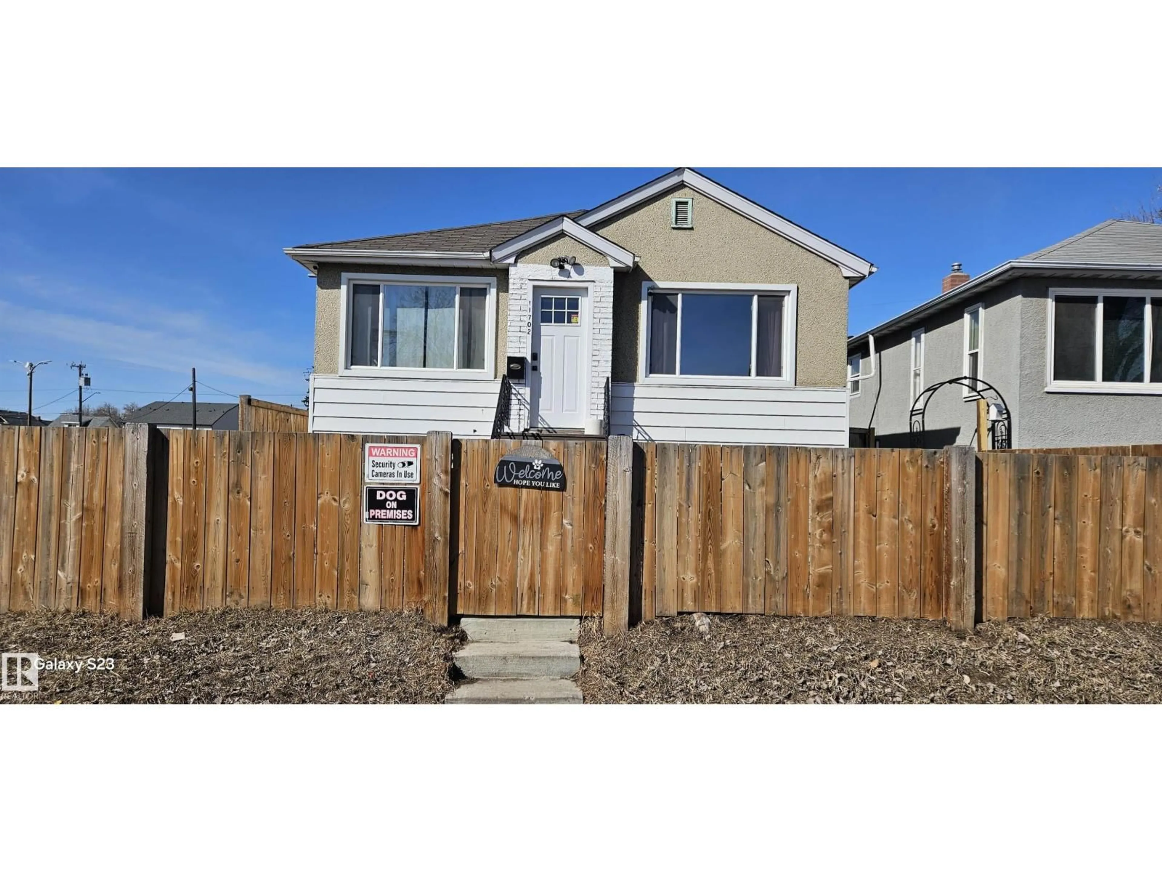 Home with vinyl exterior material, street for NW - 11702 79 ST, Edmonton Alberta T5B2K7