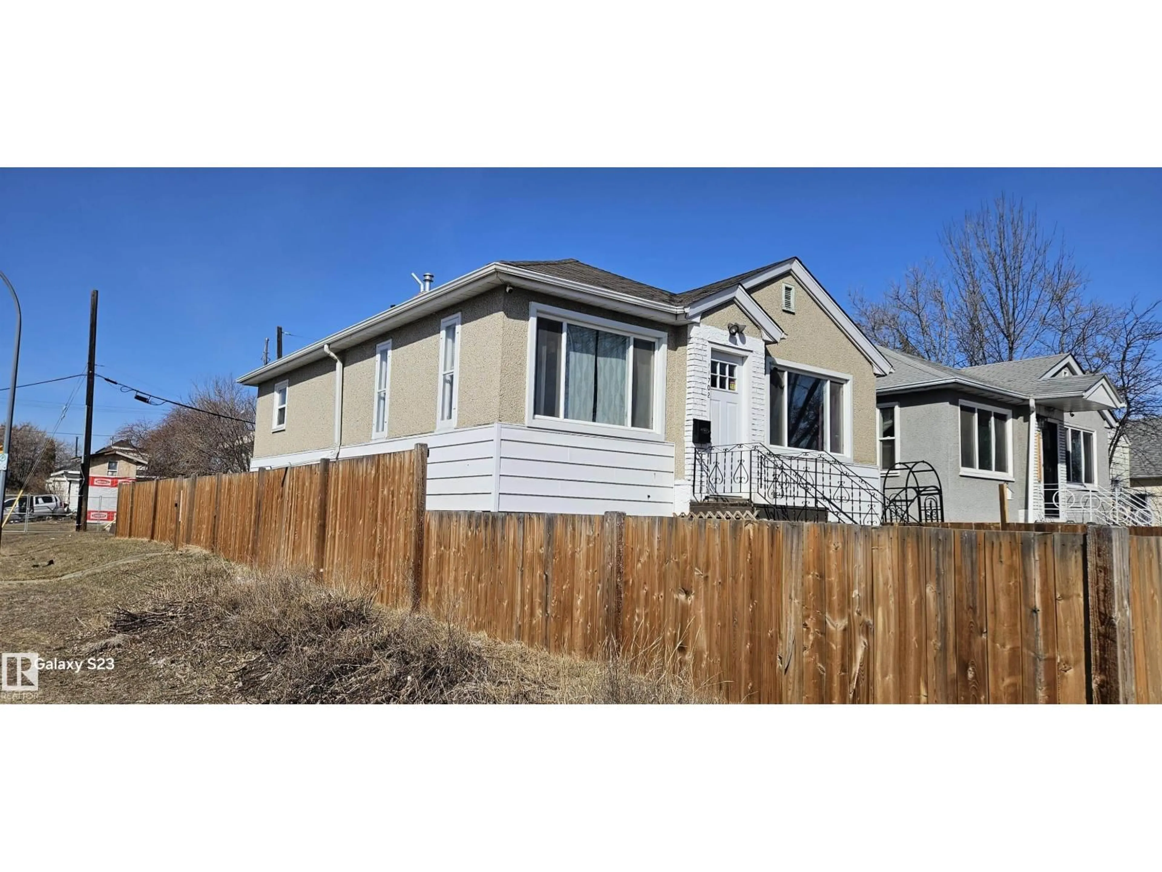 Home with vinyl exterior material, street for NW - 11702 79 ST, Edmonton Alberta T5B2K7