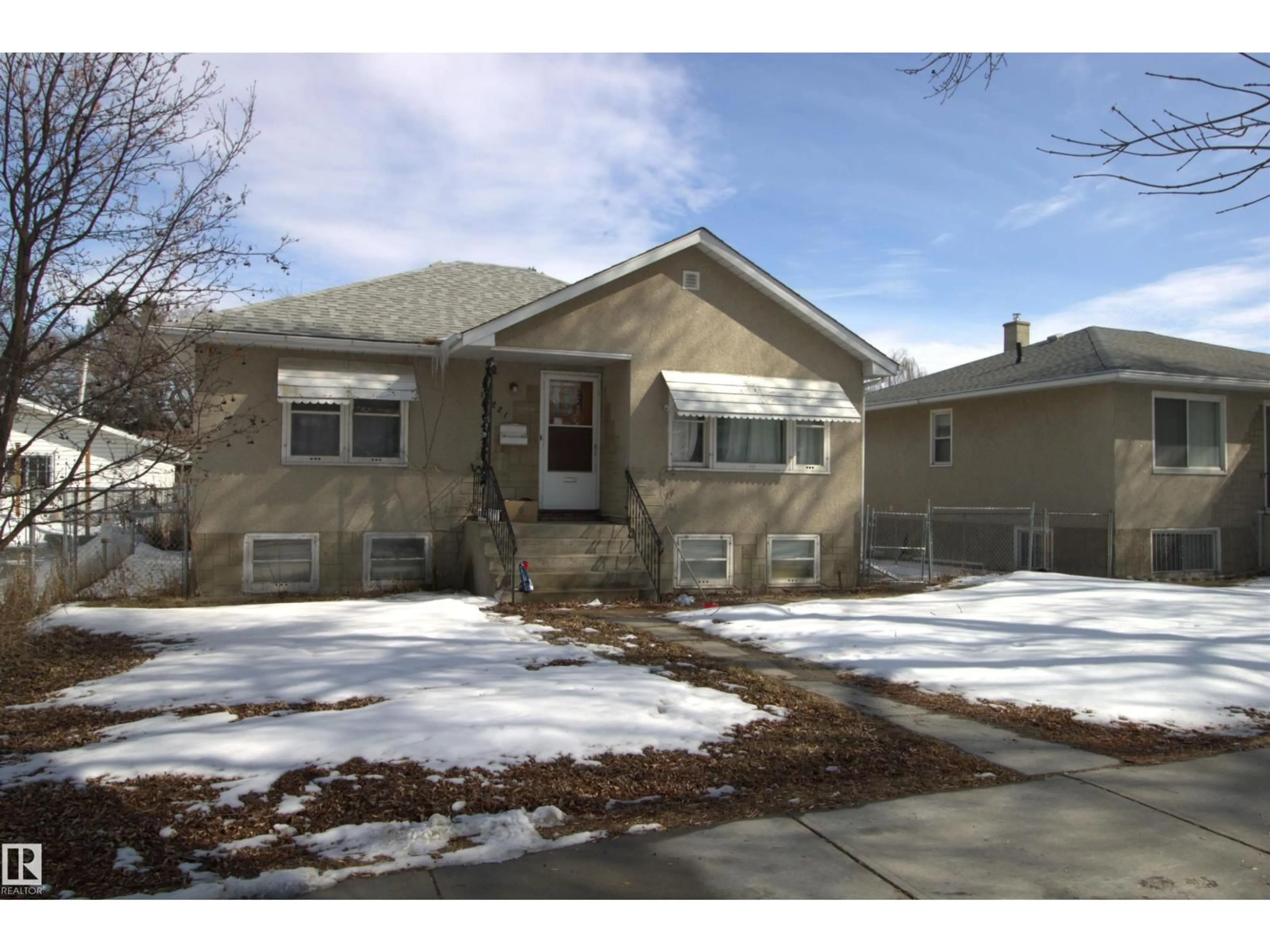 Home with vinyl exterior material, street for 12221 94 ST, Edmonton Alberta T5G1K2