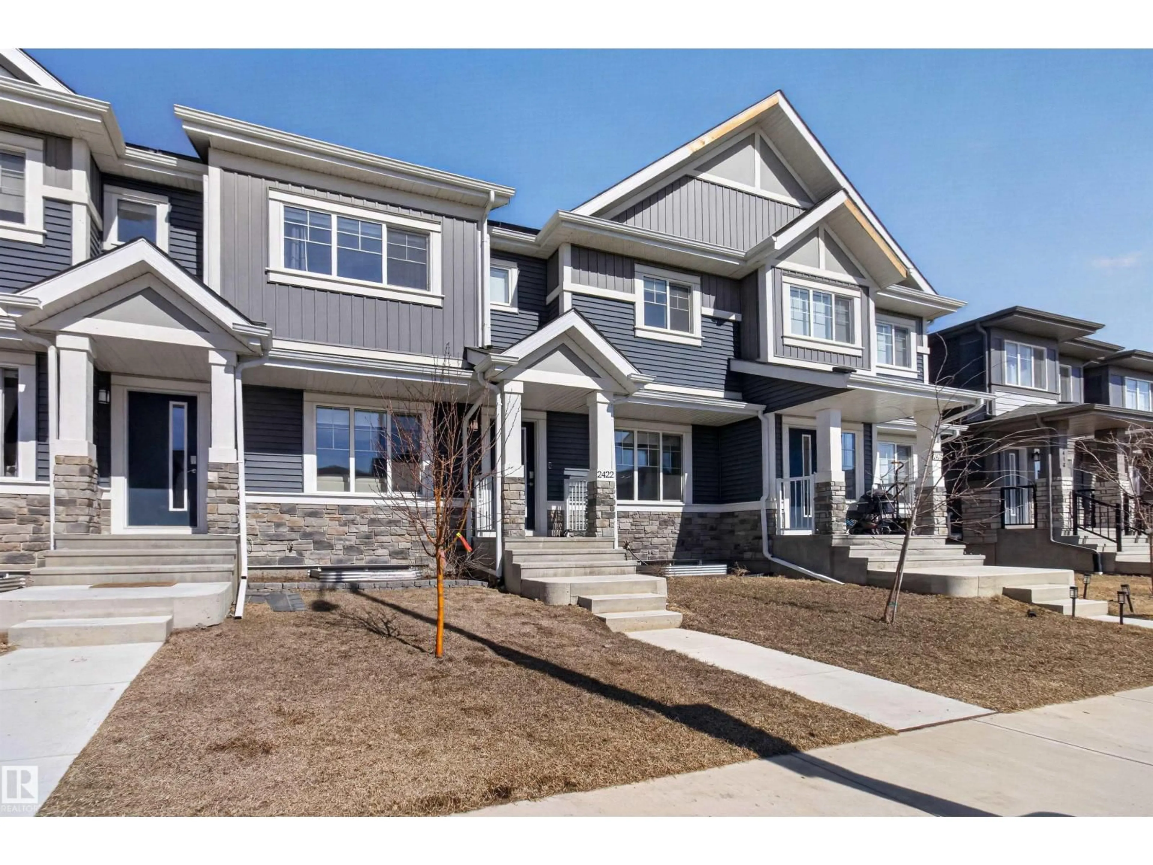 Home with vinyl exterior material, street for 2422 TRUMPETER WY, Edmonton Alberta T5V1T8