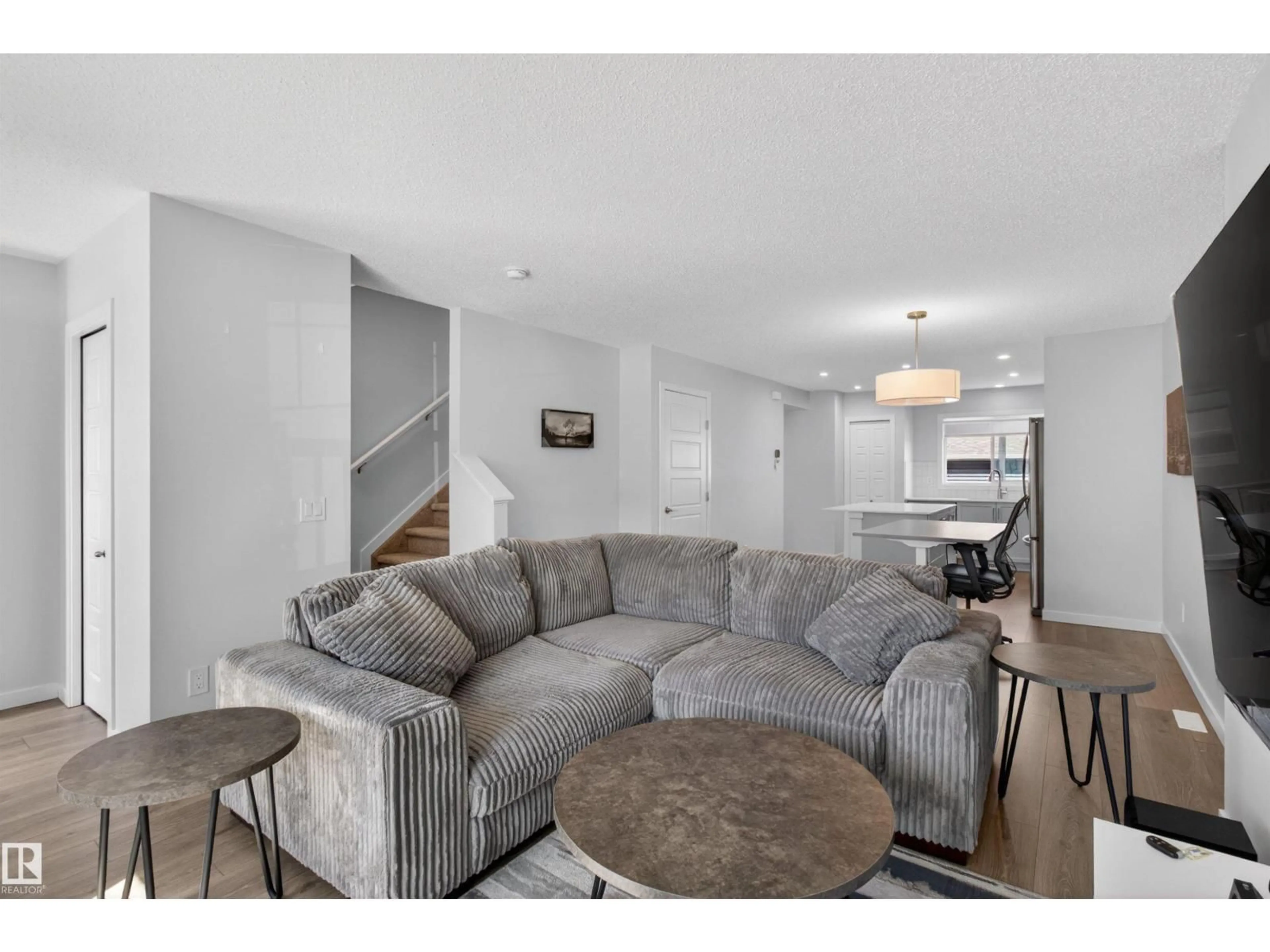 Living room with furniture, unknown for 2422 TRUMPETER WY, Edmonton Alberta T5V1T8