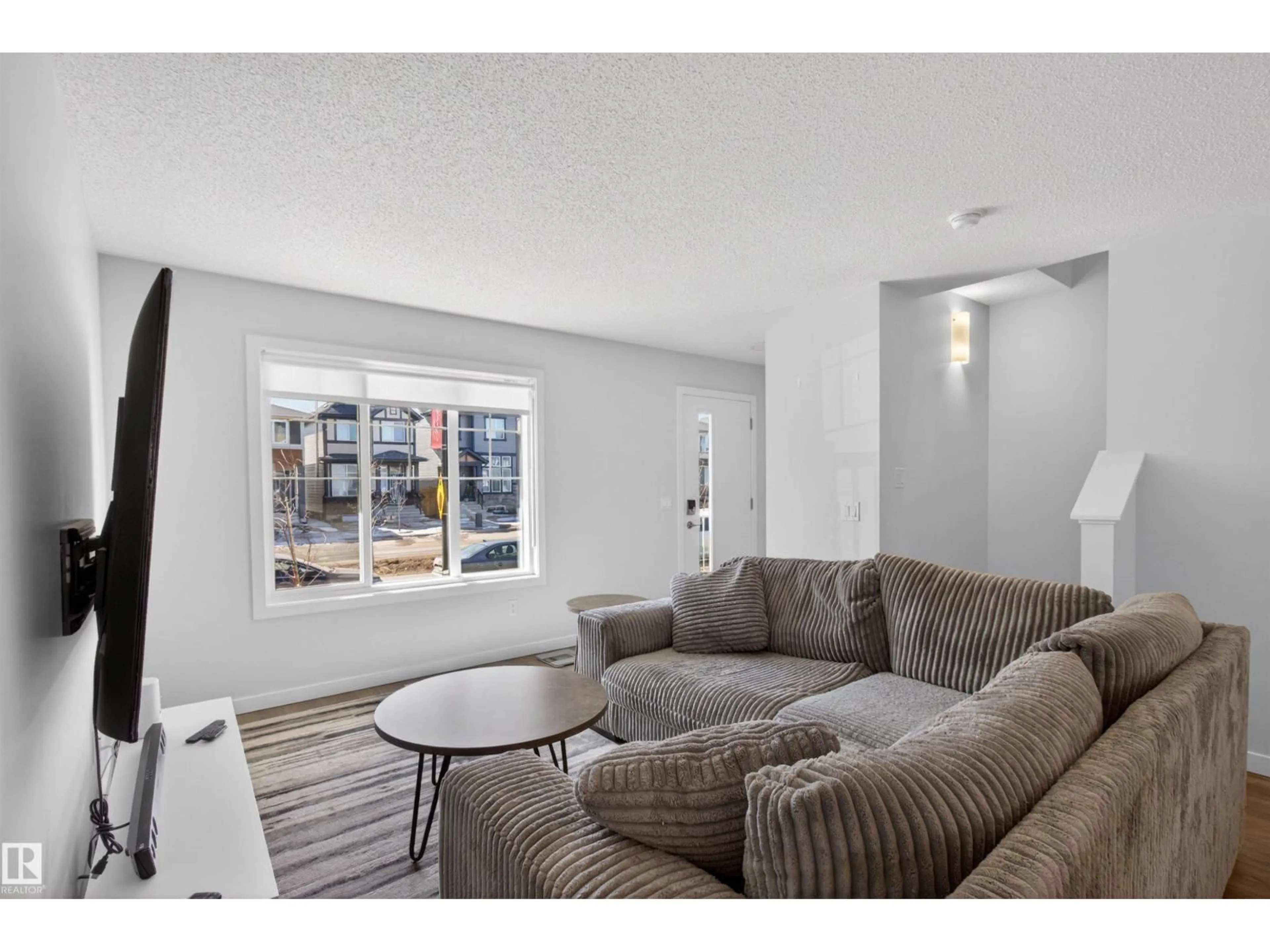 Living room with furniture, unknown for 2422 TRUMPETER WY, Edmonton Alberta T5V1T8