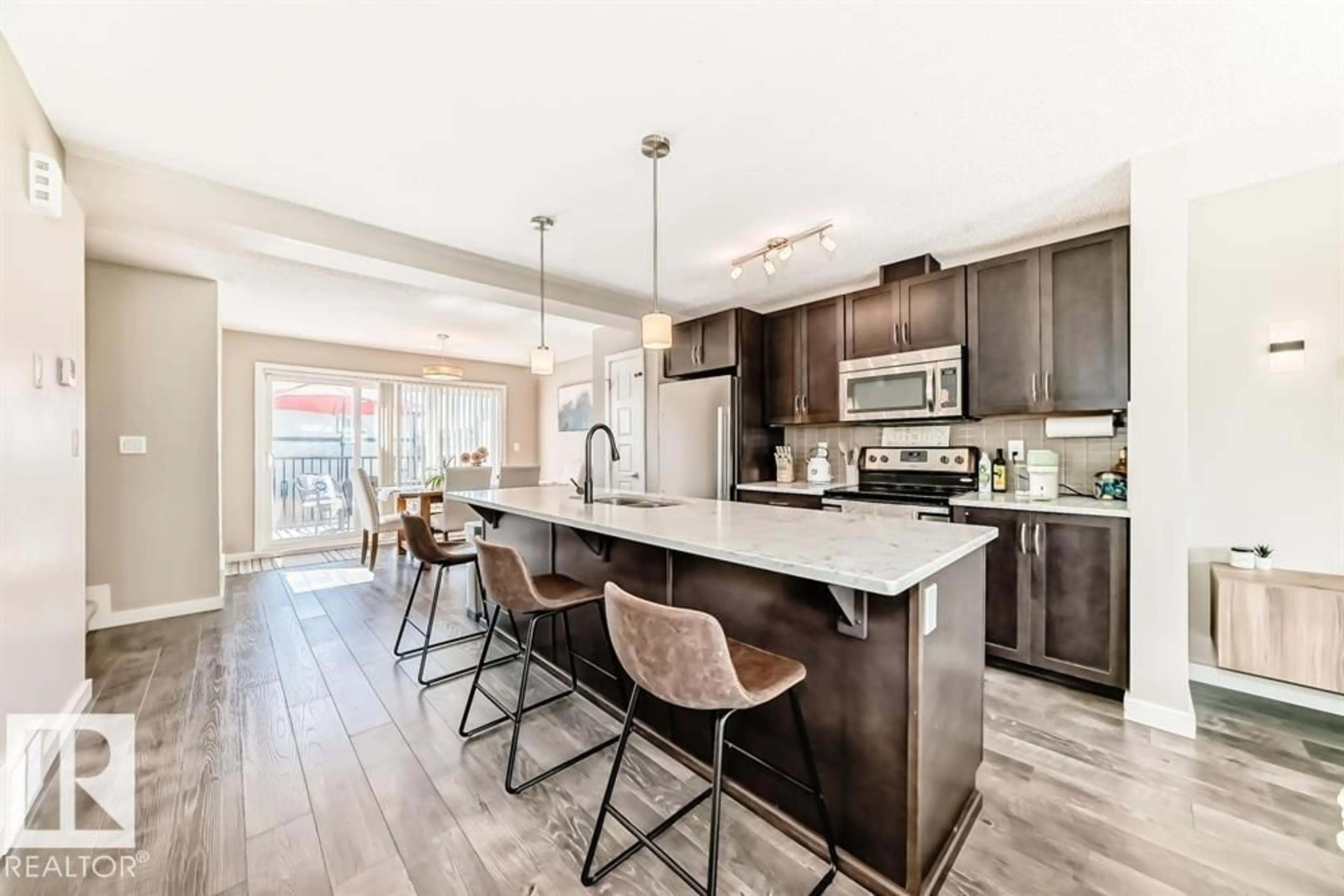 Open concept kitchen, ceramic/tile floor for 3346 15A AV, Edmonton Alberta T6T0Y1