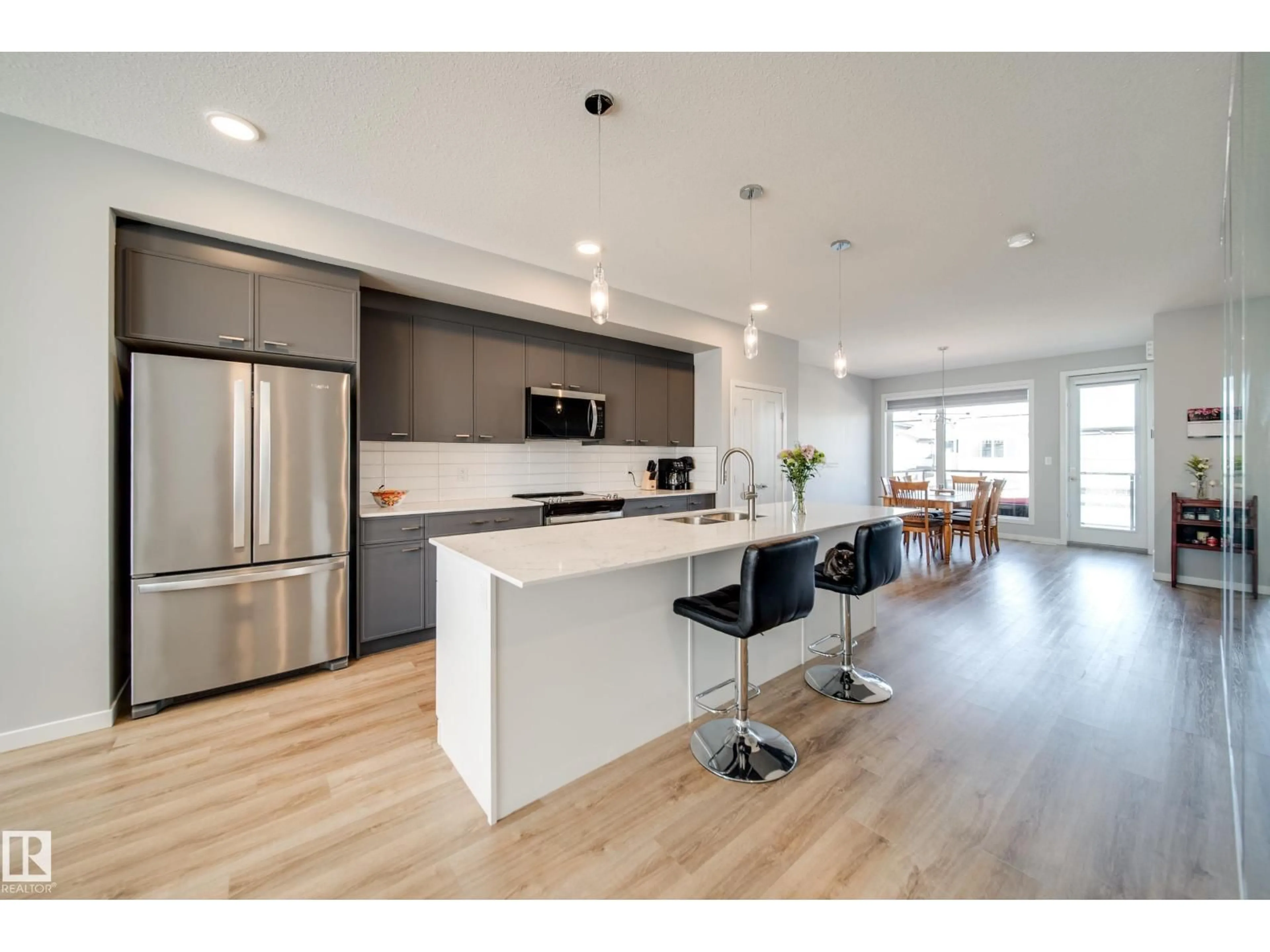 Open concept kitchen, wood/laminate floor for 3330 KULAY WY, Edmonton Alberta T6W5E7
