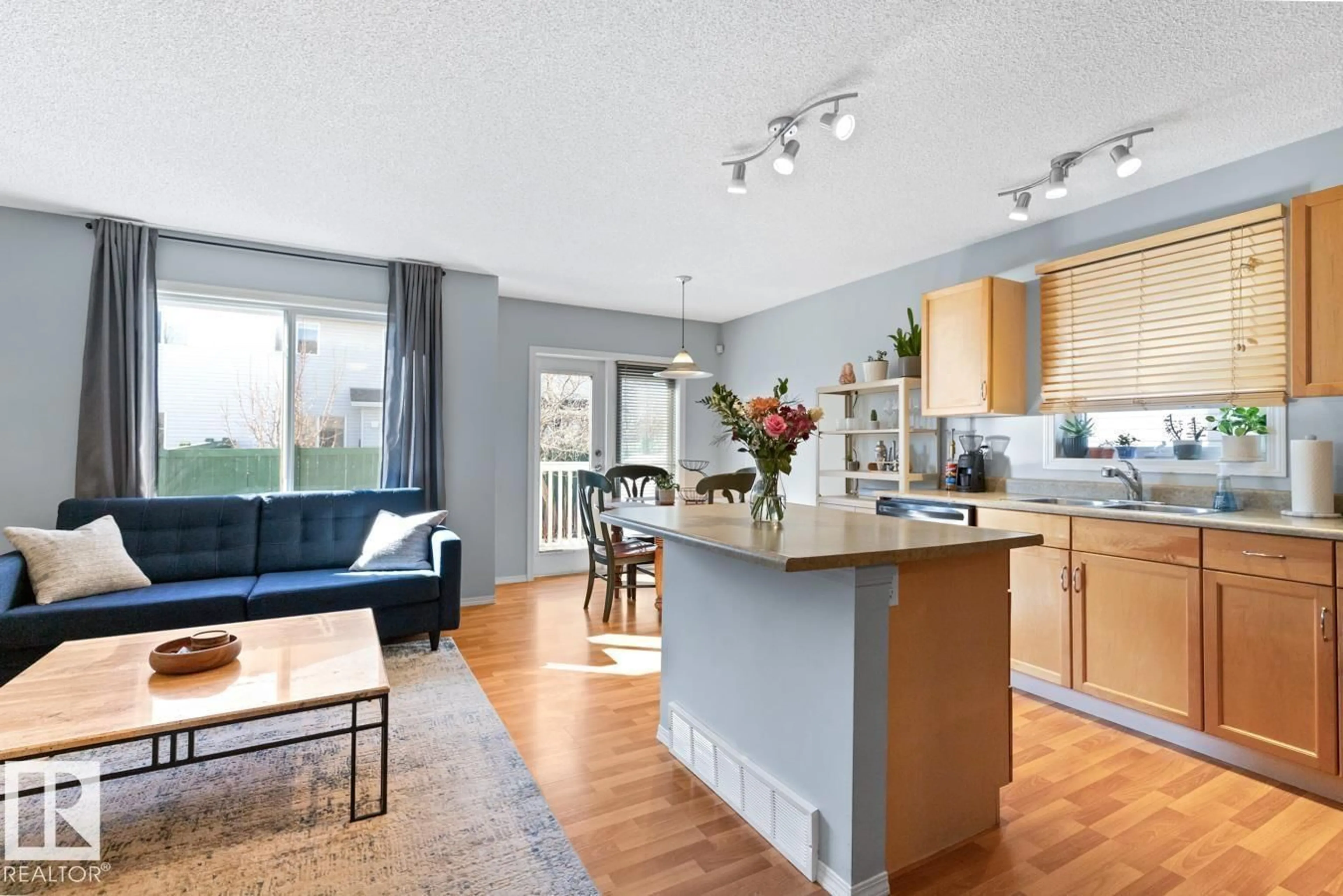 Open concept kitchen, wood/laminate floor for 115 - 27 CHESTERMERE DR, Sherwood Park Alberta T8H2W4