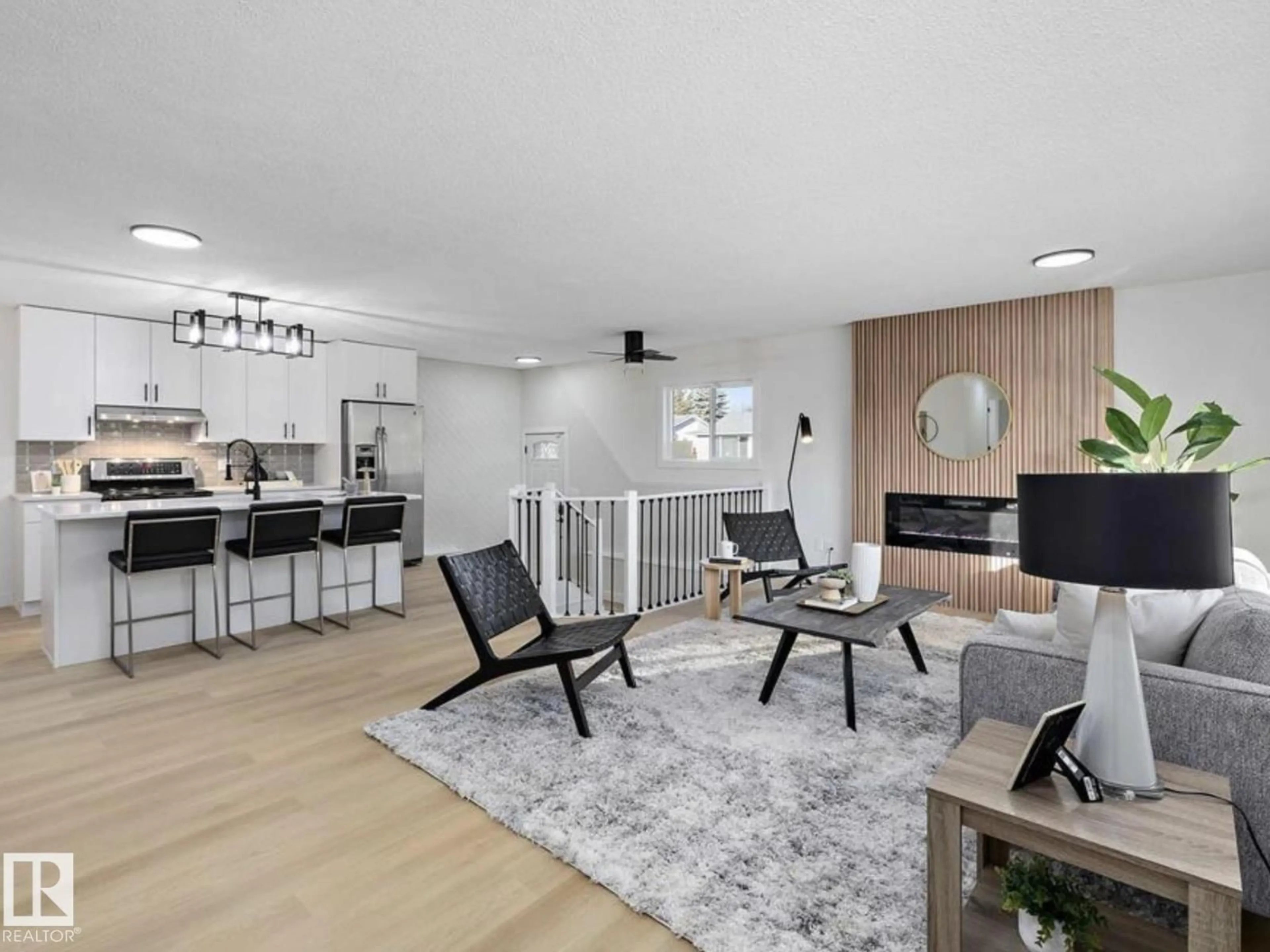 Living room with furniture, wood/laminate floor for NW - 14736 122 ST, Edmonton Alberta T5X1V9