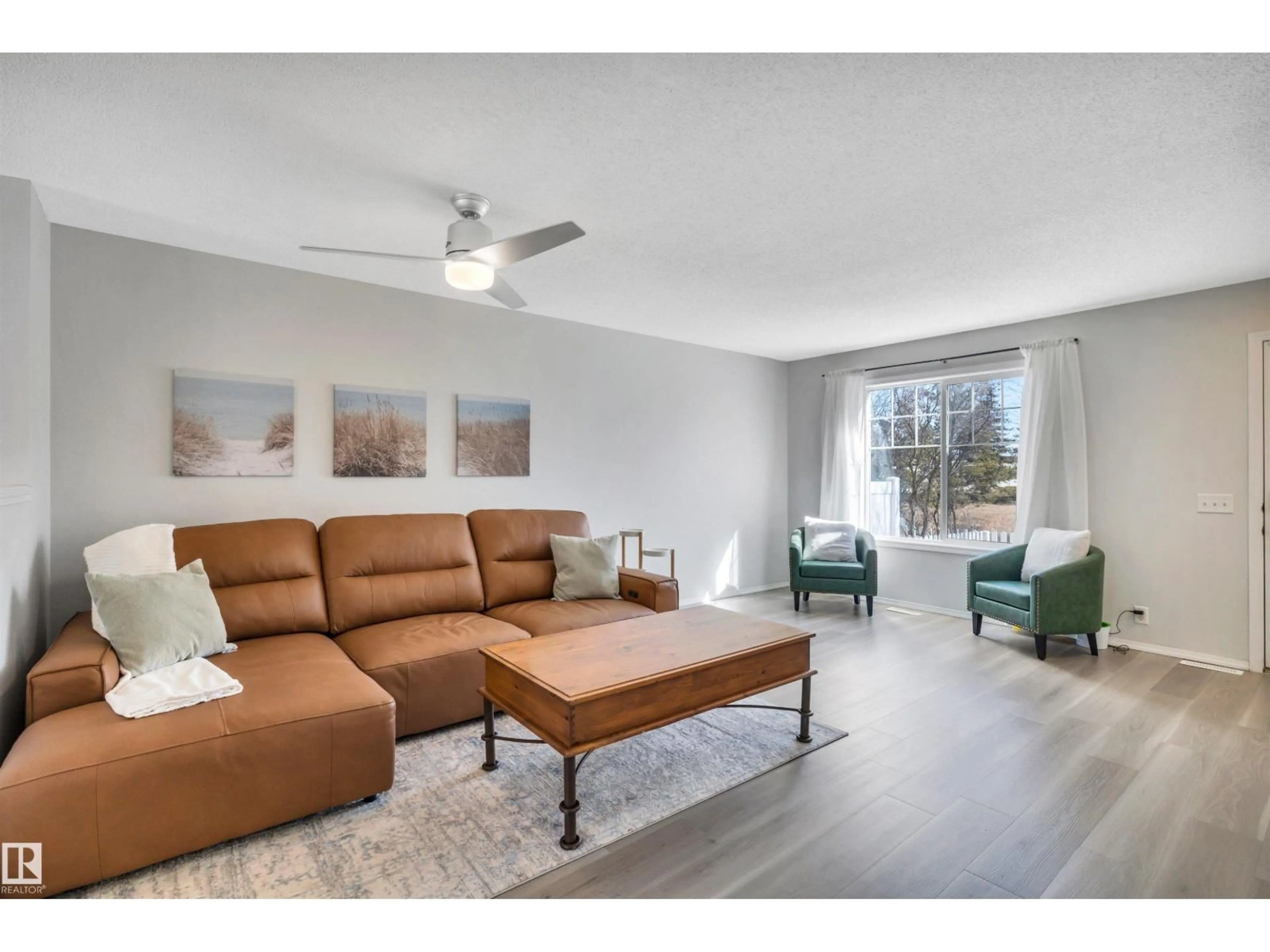 Living room with furniture, wood/laminate floor for 3075 - 51 TRELLE CR, Edmonton Alberta T6R3V5
