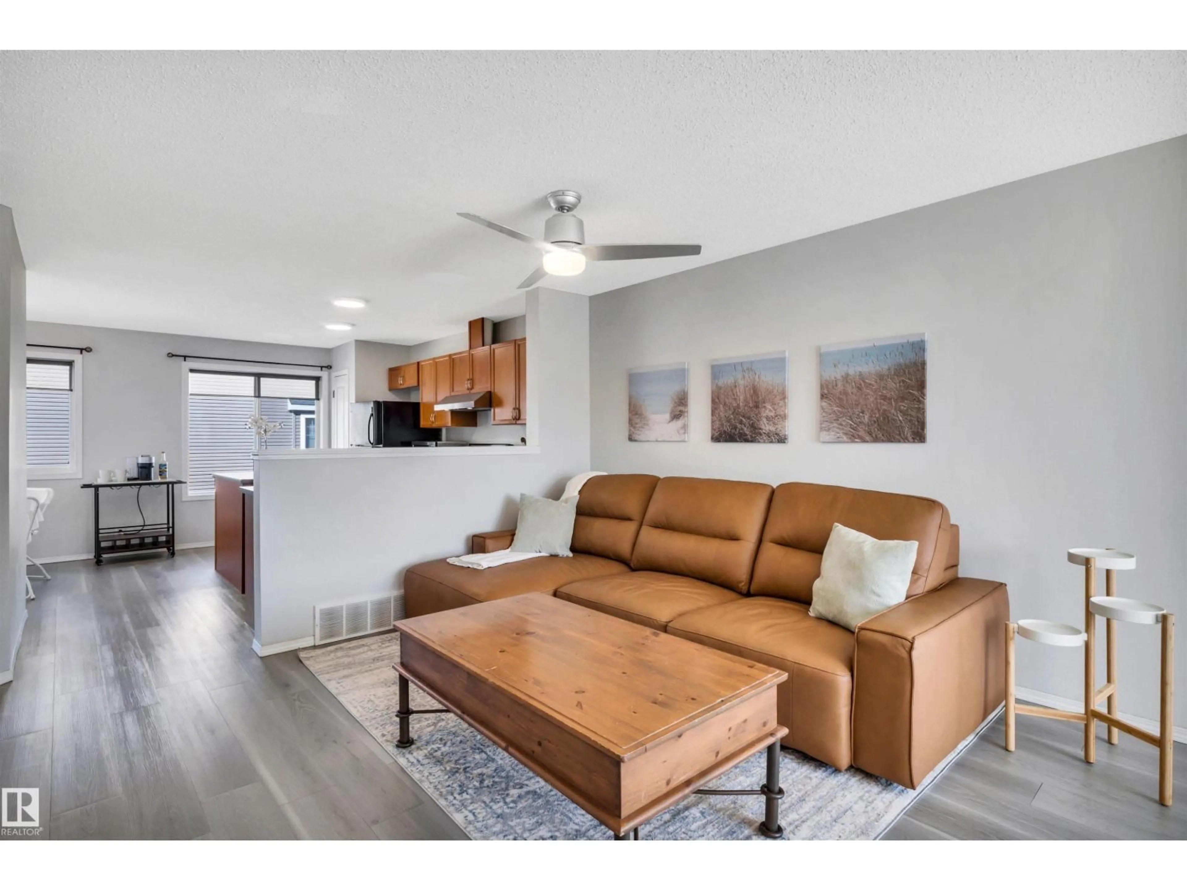 Living room with furniture, wood/laminate floor for 3075 - 51 TRELLE CR, Edmonton Alberta T6R3V5