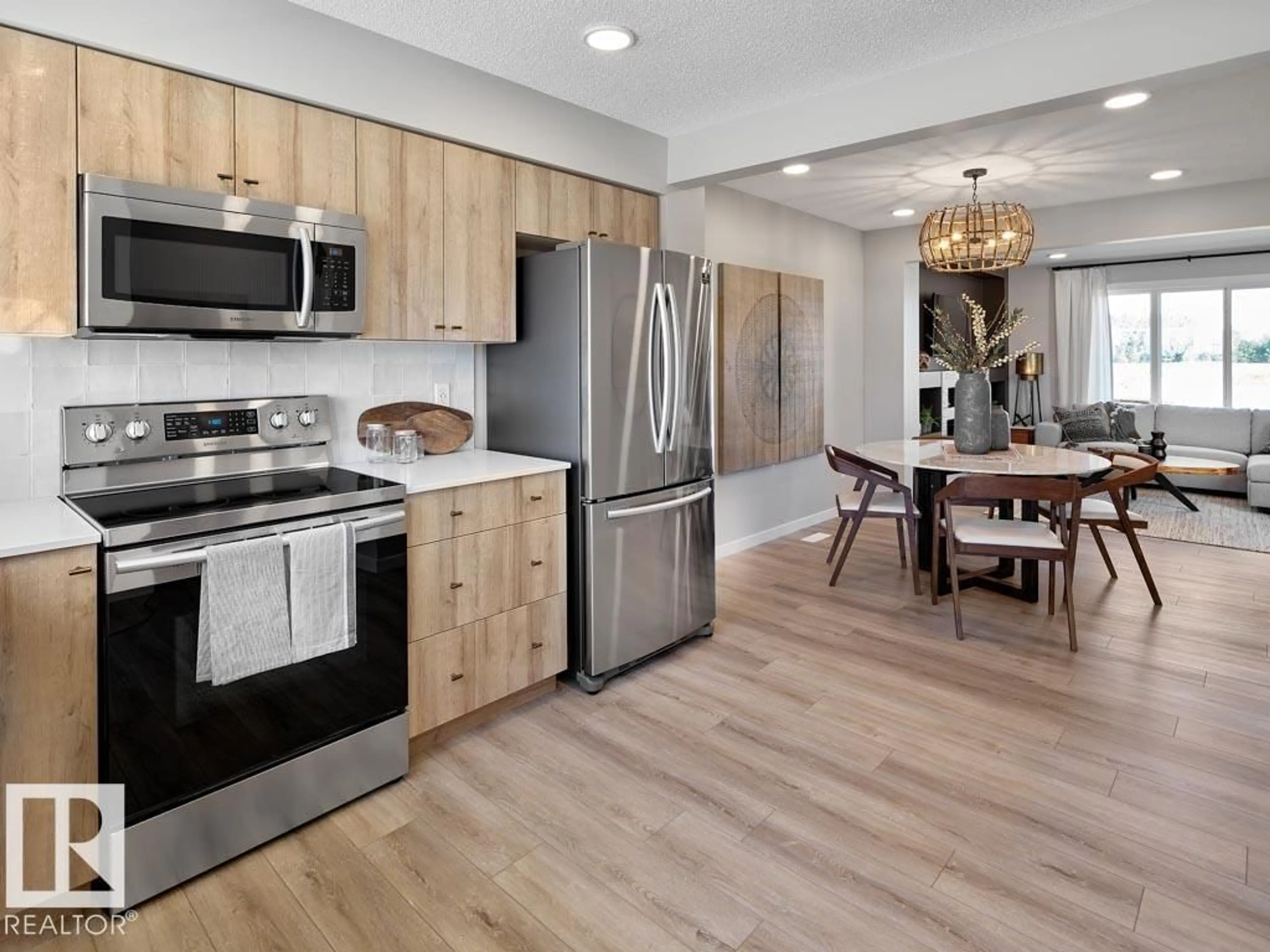 Open concept kitchen, wood/laminate floor for #13 - 3705 141 ST, Edmonton Alberta T6W5M9