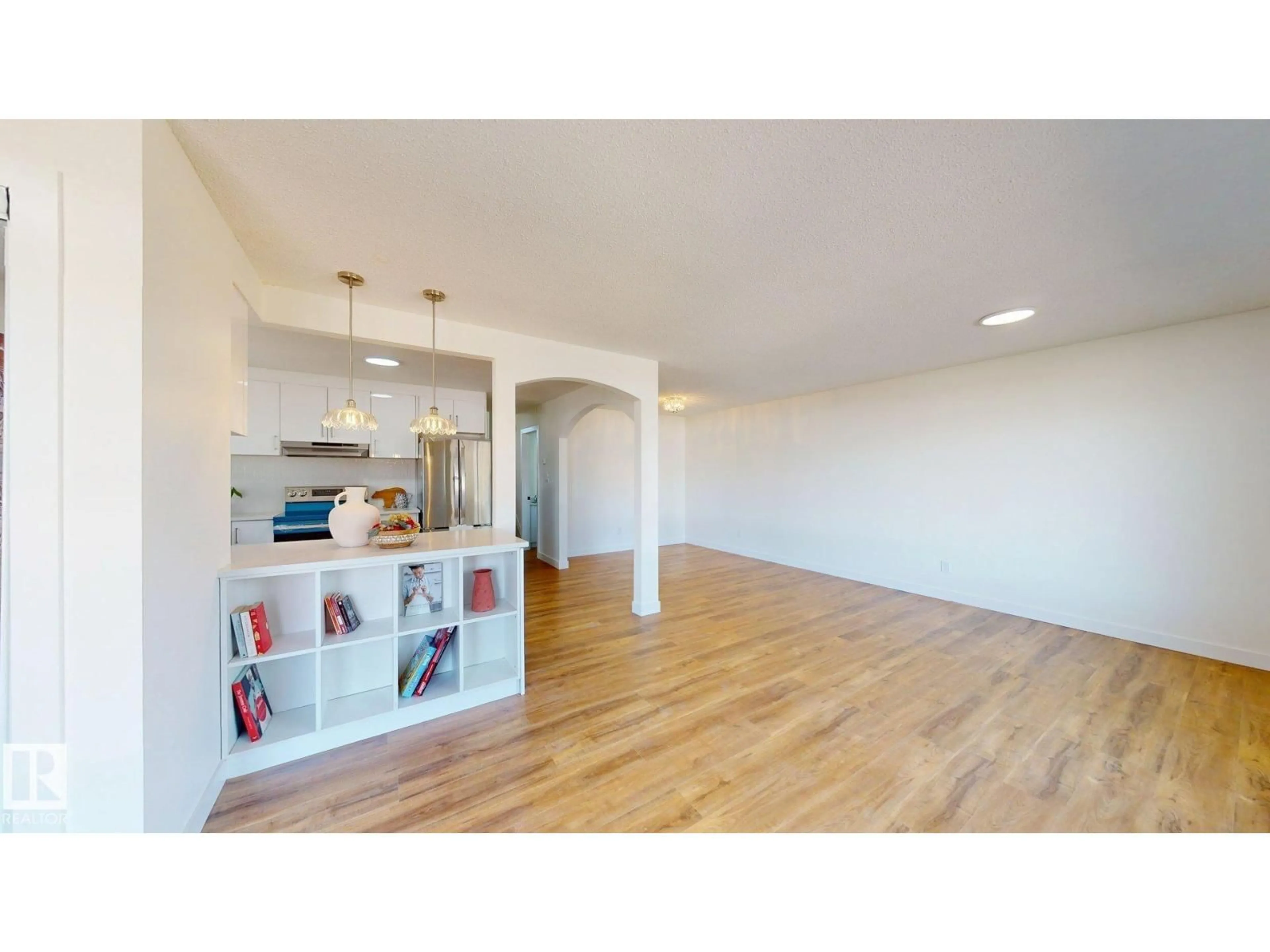 Open concept kitchen, wood/laminate floor for 8515 86 AV, Edmonton Alberta T6C1J4