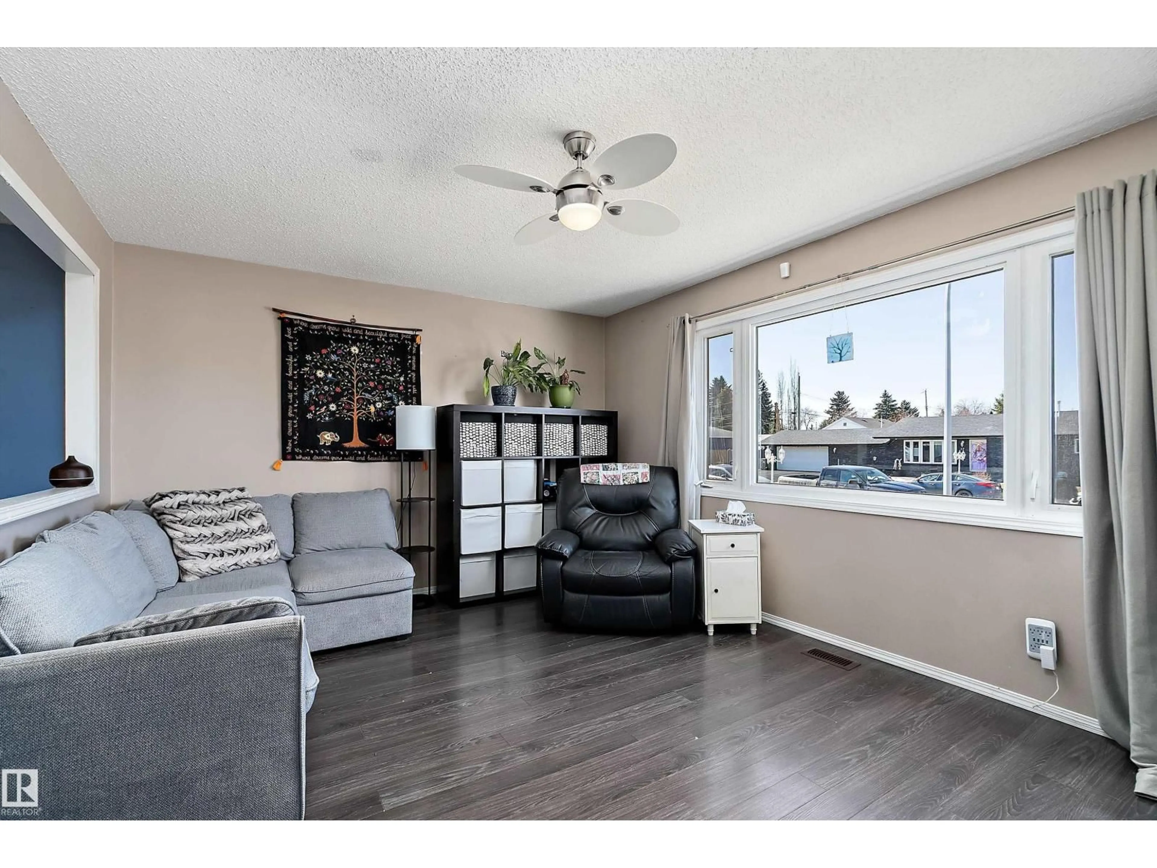 Living room with furniture, wood/laminate floor for 28 CAMELOT AV, Leduc Alberta T9E4M3