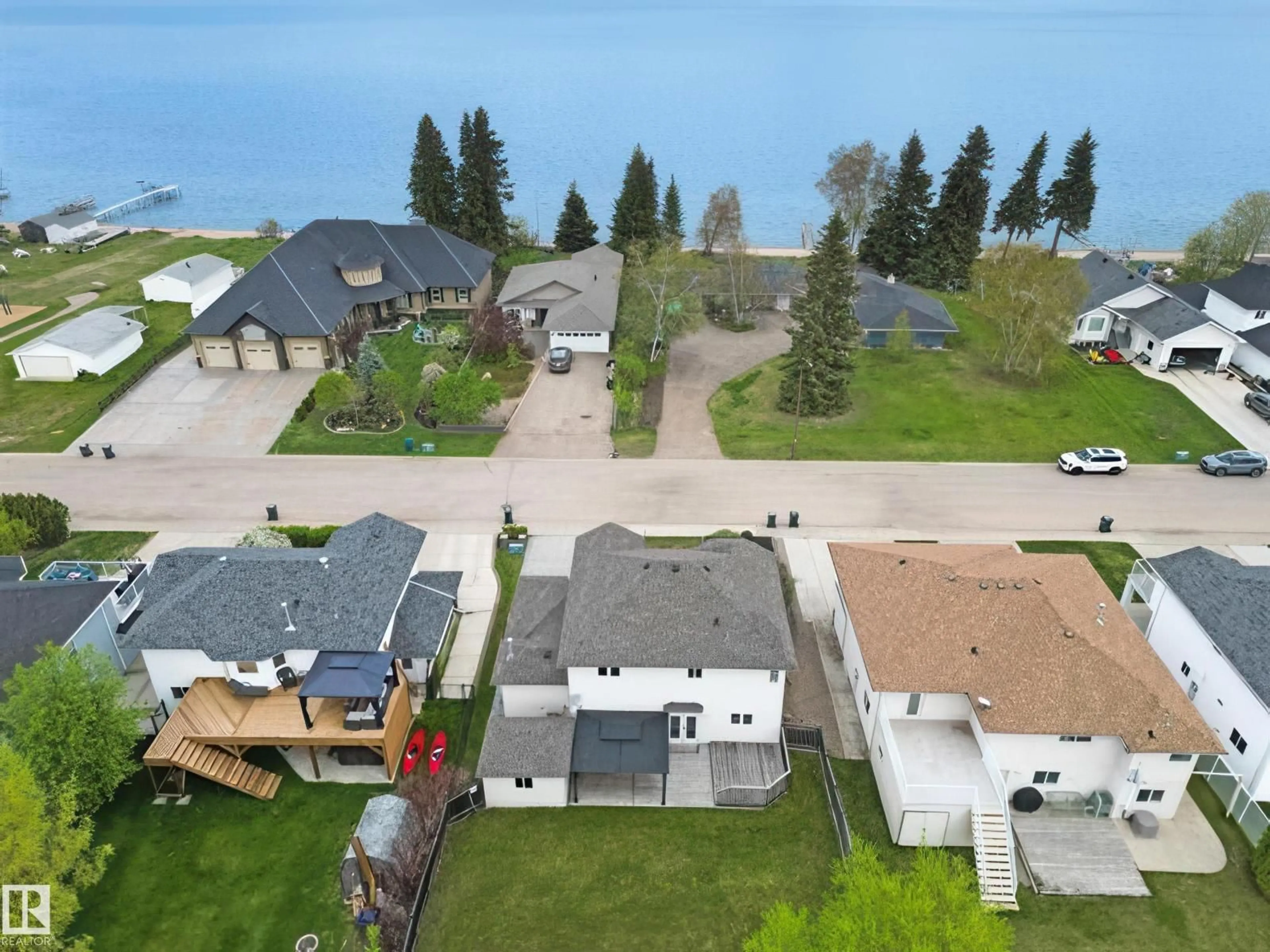 A pic from outside/outdoor area/front of a property/back of a property/a pic from drone, water/lake/river/ocean view for 807 BEACH AV, Cold Lake Alberta T9M1K8