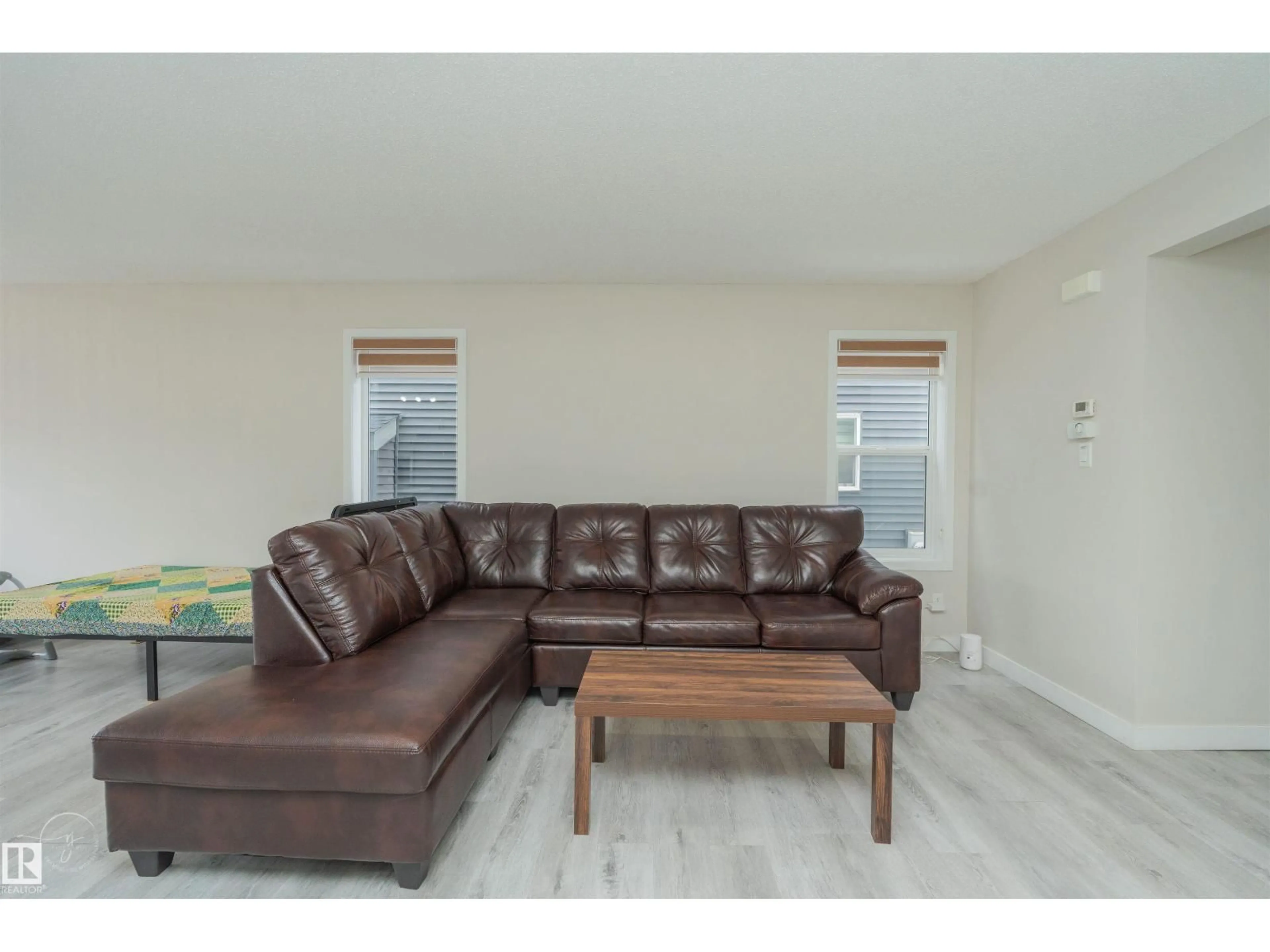 Living room with furniture, wood/laminate floor for SW - 2122 52A ST, Edmonton Alberta T6X1X4