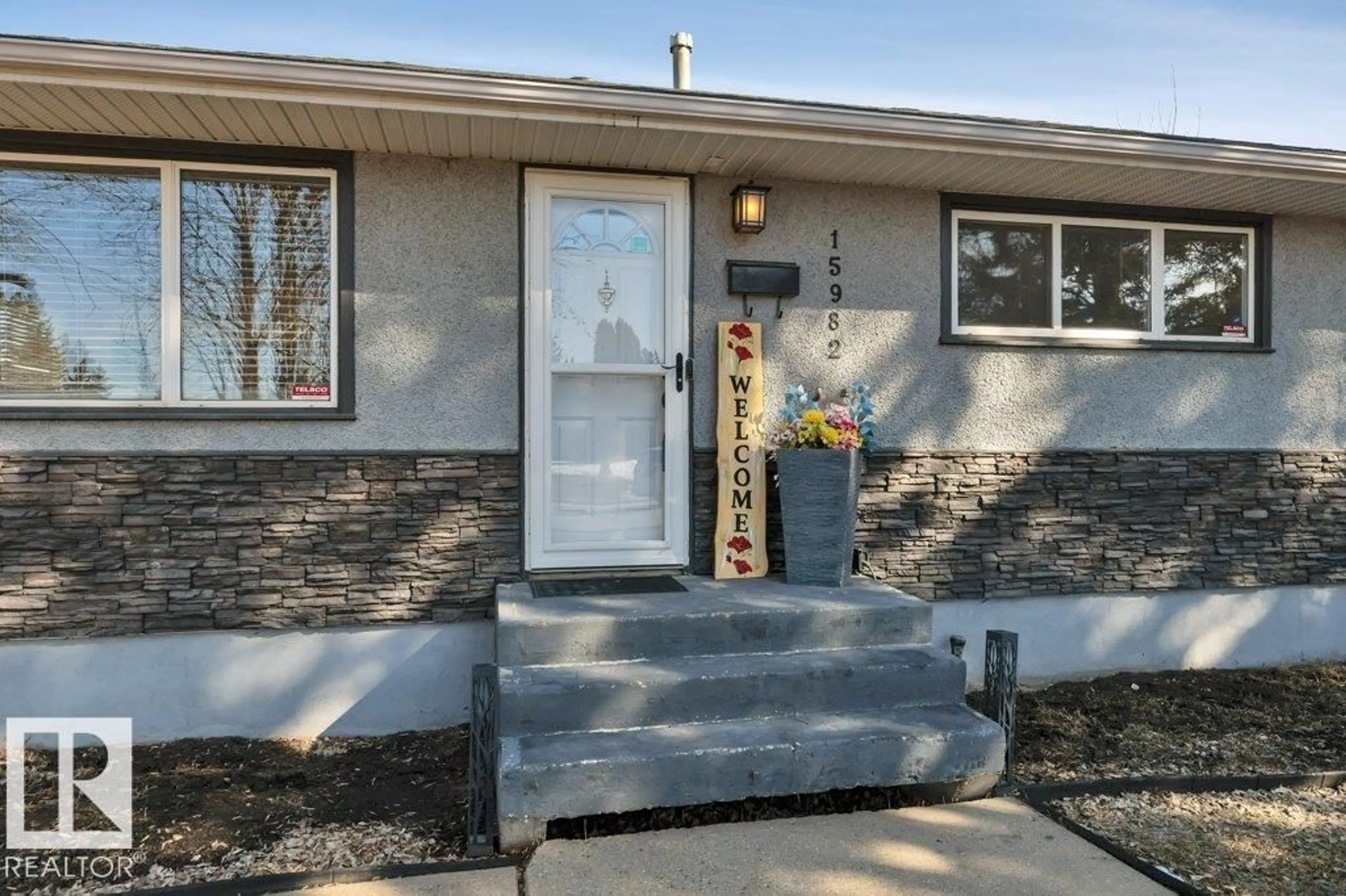 Home with vinyl exterior material, street for NW - 15982 110B AV, Edmonton Alberta T5P1J4