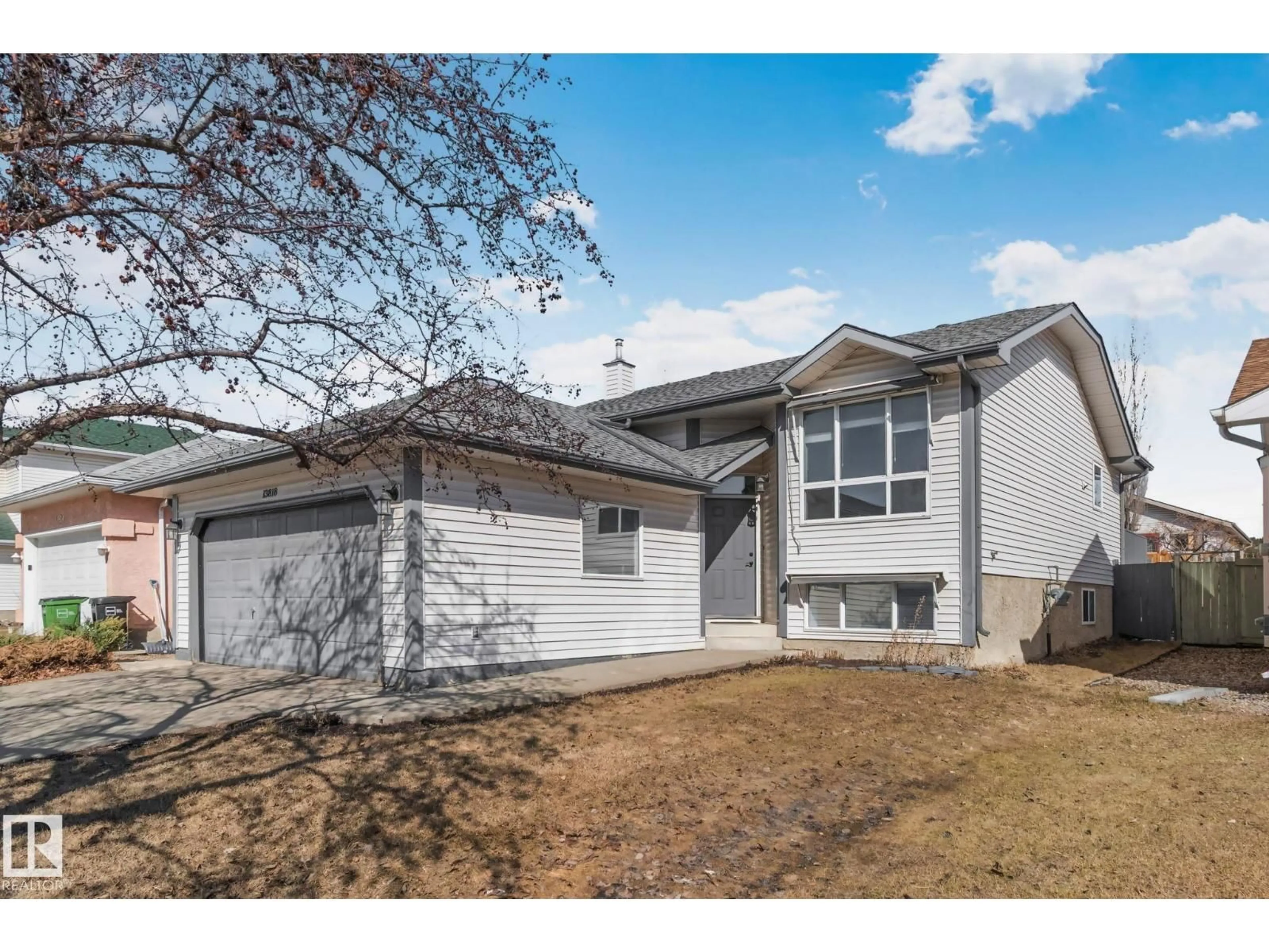 Home with vinyl exterior material, street for NW - 13818 131A AV, Edmonton Alberta T5L5A7