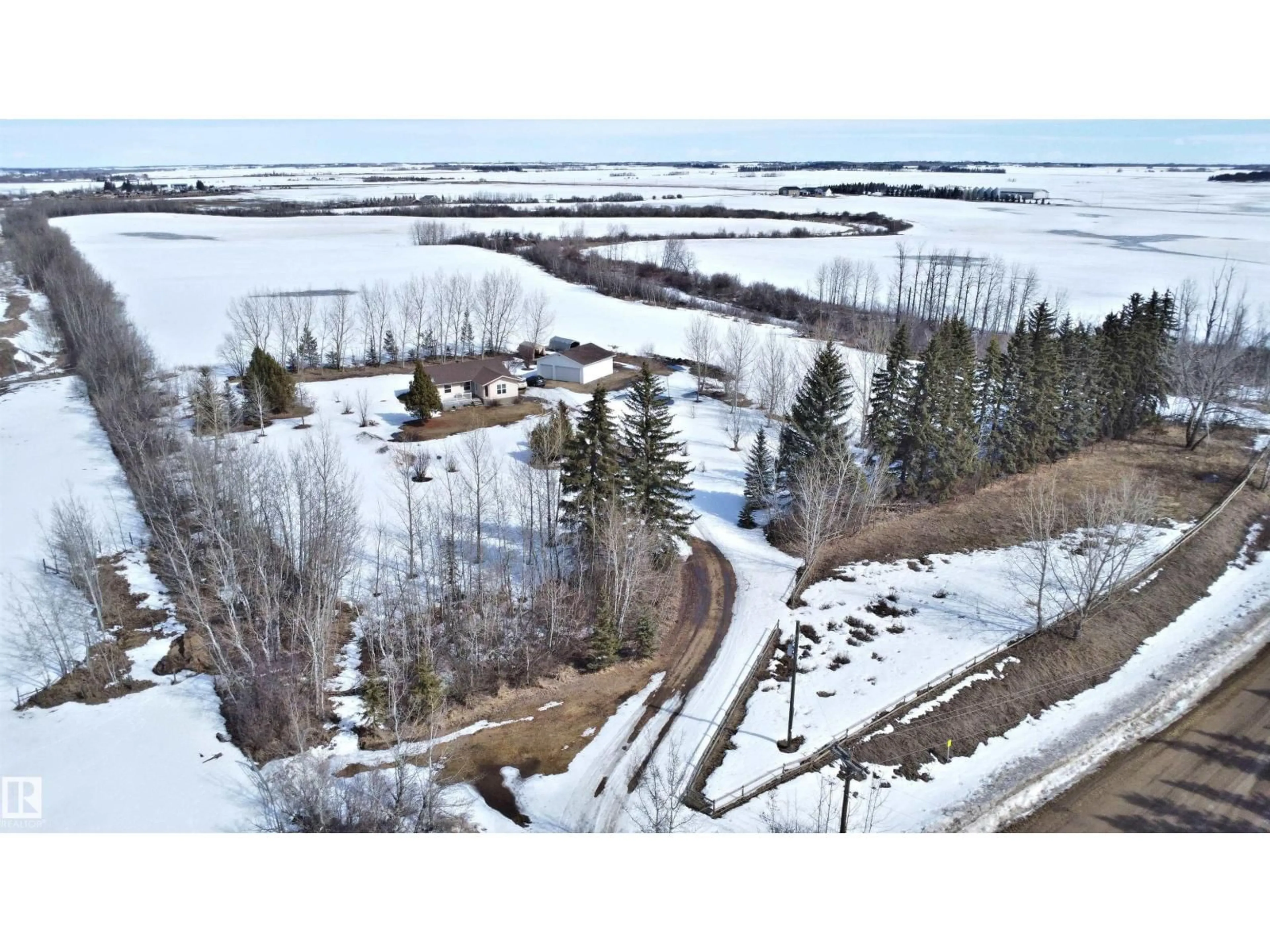 A pic from outside/outdoor area/front of a property/back of a property/a pic from drone, water/lake/river/ocean view for 26416 TWP ROAD 544, Rural Sturgeon County Alberta T8T1N6