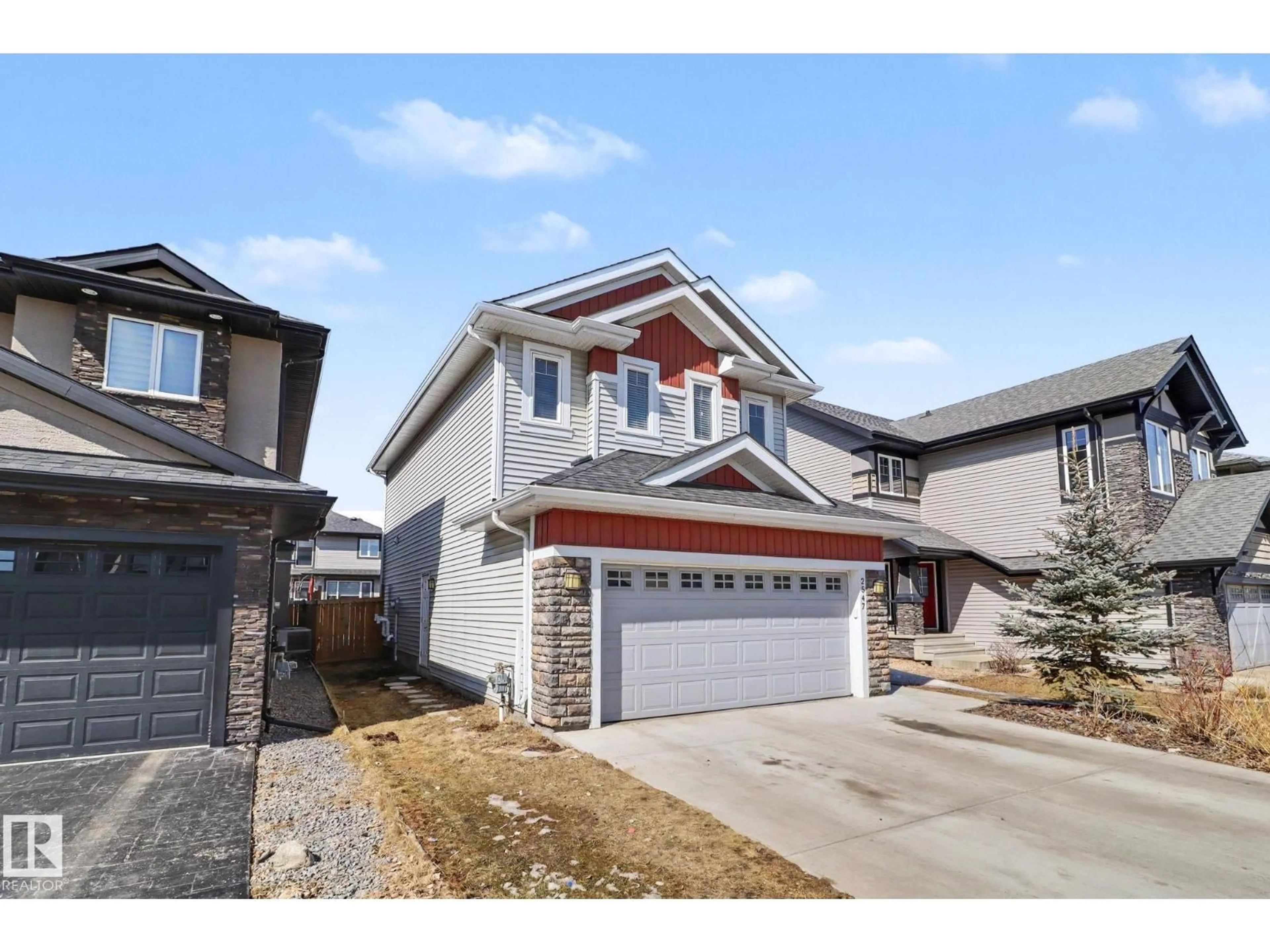 Home with vinyl exterior material, street for 2547 AMERONGEN CR, Edmonton Alberta T6W3C2