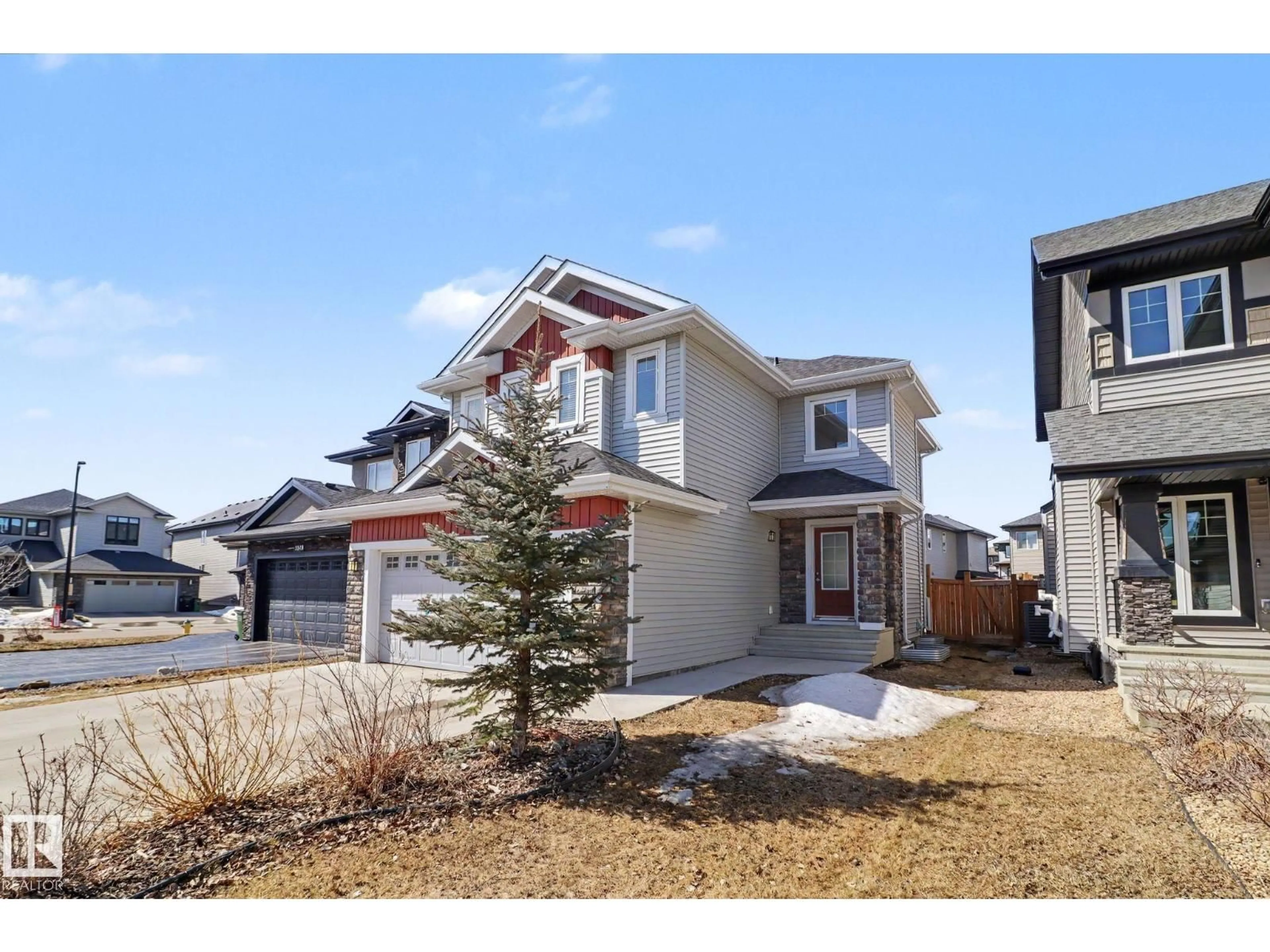 Home with vinyl exterior material, street for 2547 AMERONGEN CR, Edmonton Alberta T6W3C2