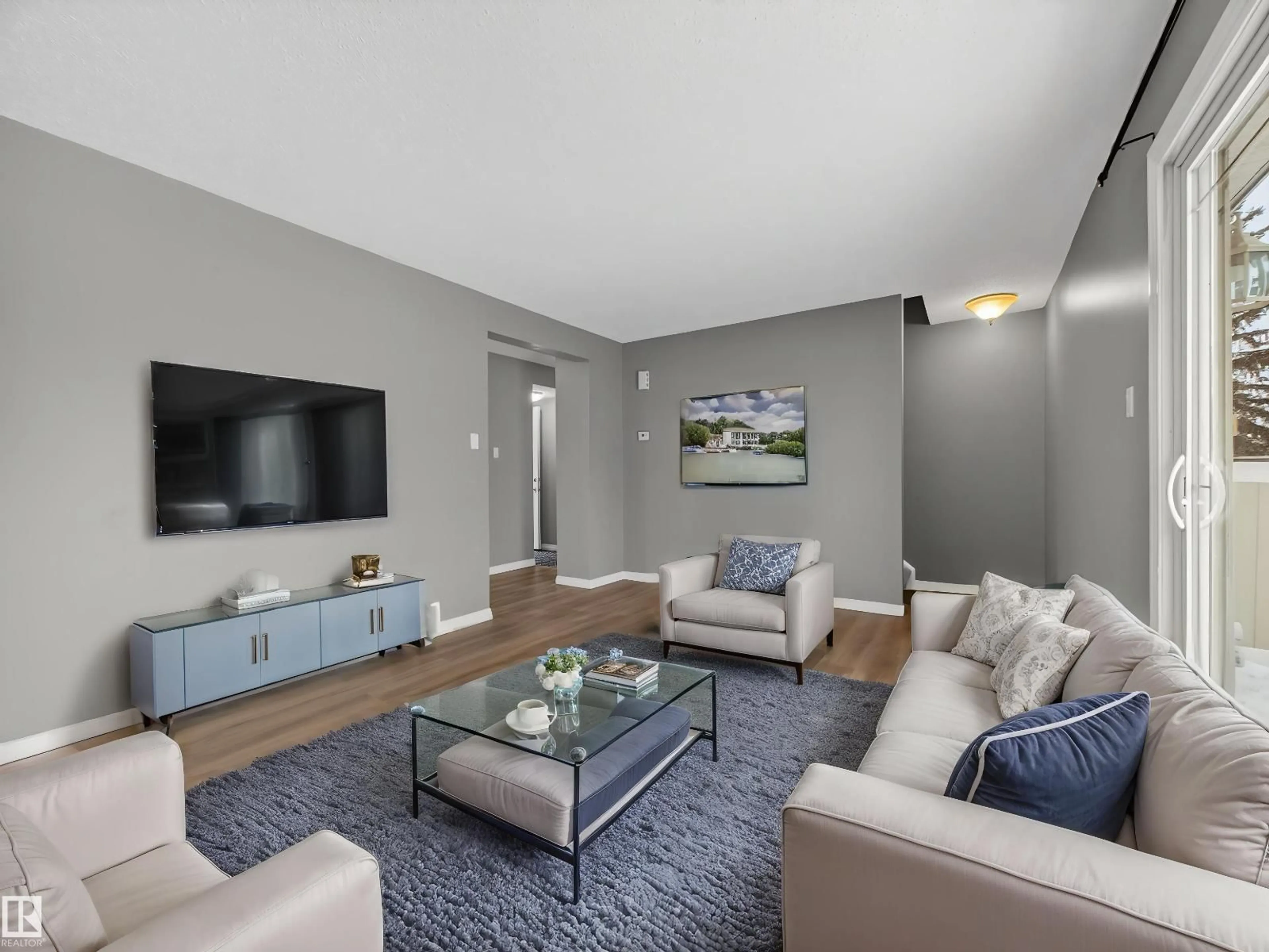 Living room with furniture, unknown for 7715 37 AV, Edmonton Alberta T6K1T9