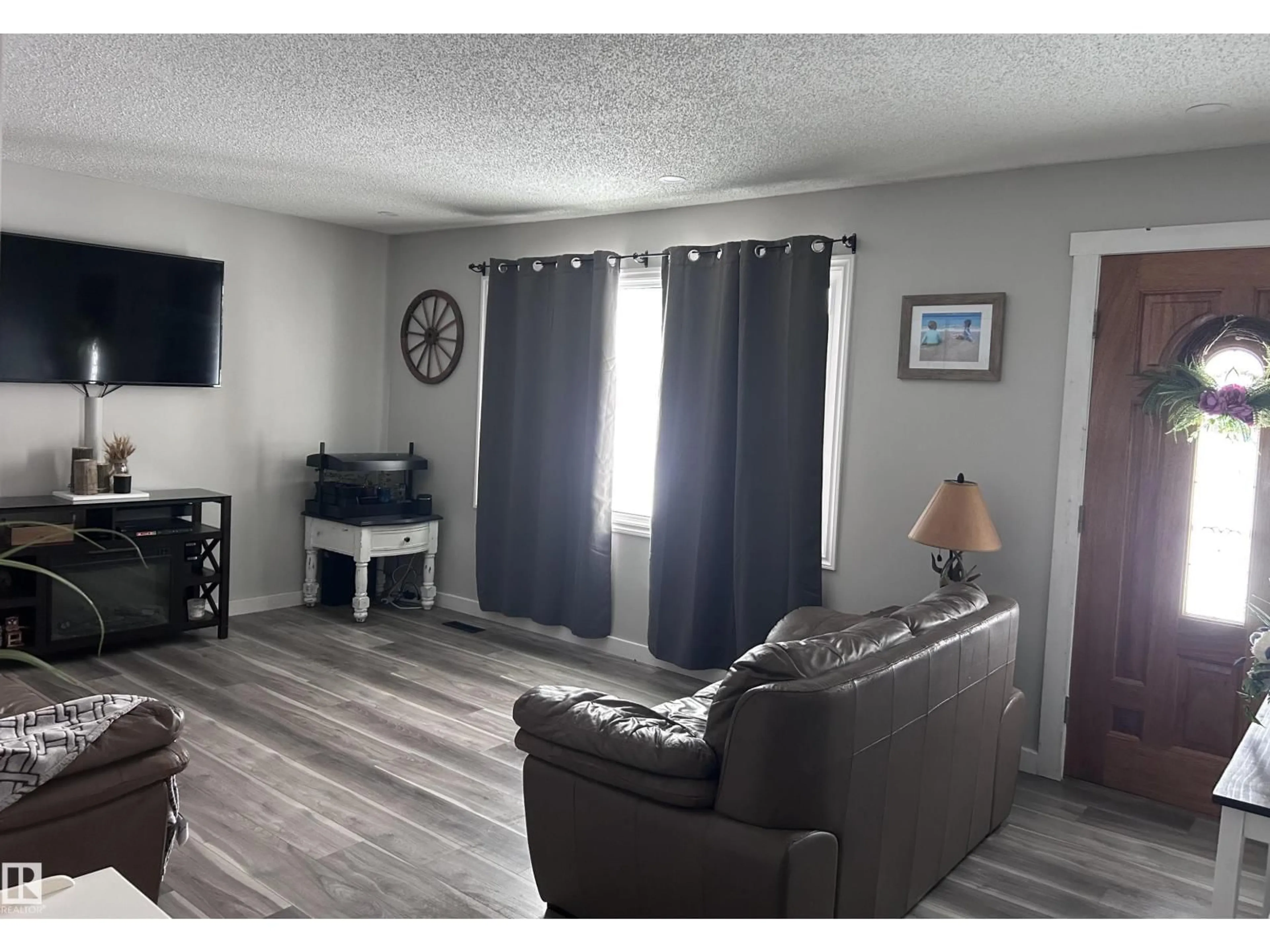 Living room with furniture, unknown for 4515 54 AVE, Tofield Alberta T0B4J0