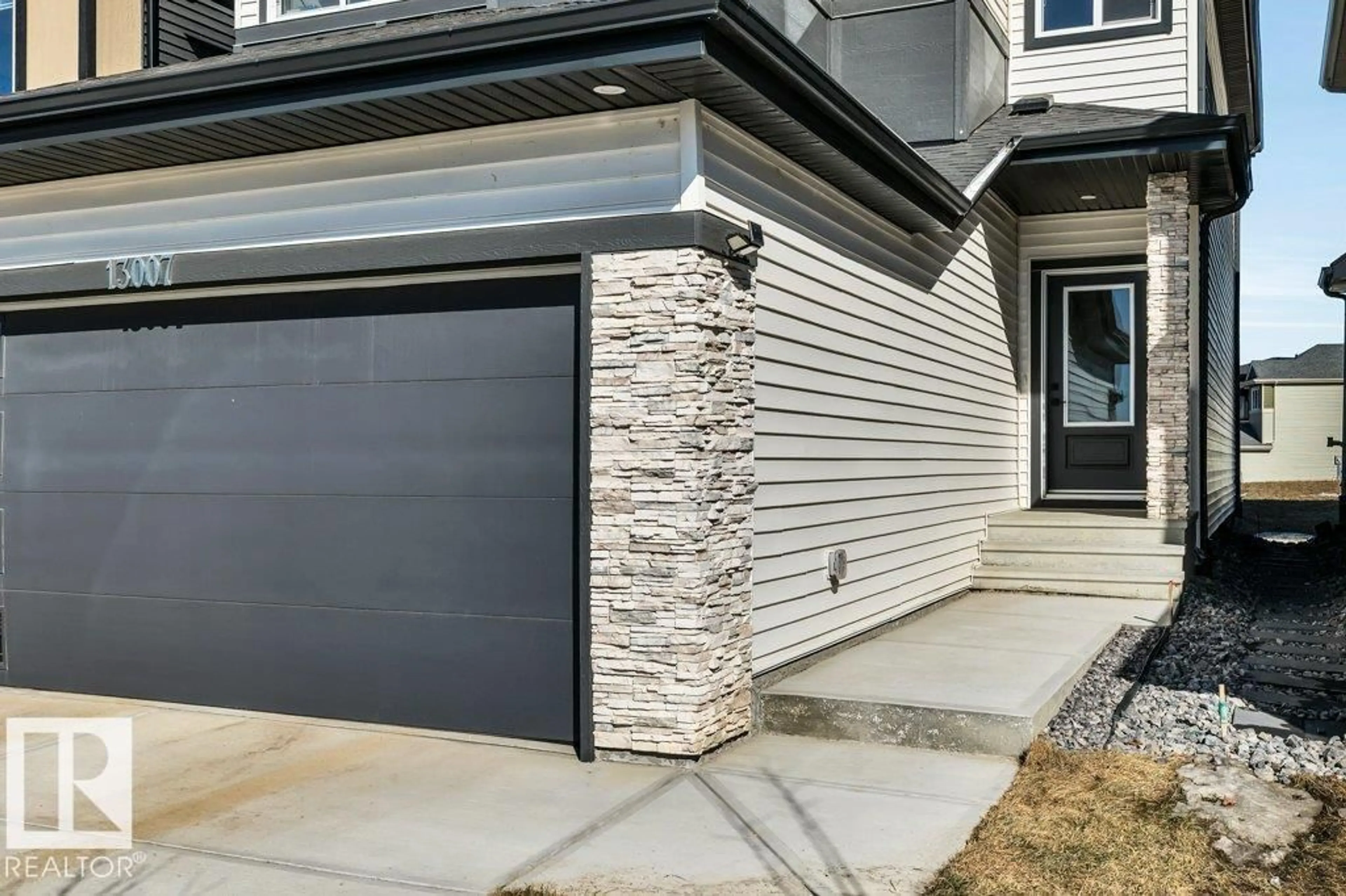 Home with vinyl exterior material, street for NW - 13007 213 ST, Edmonton Alberta T5S0T7