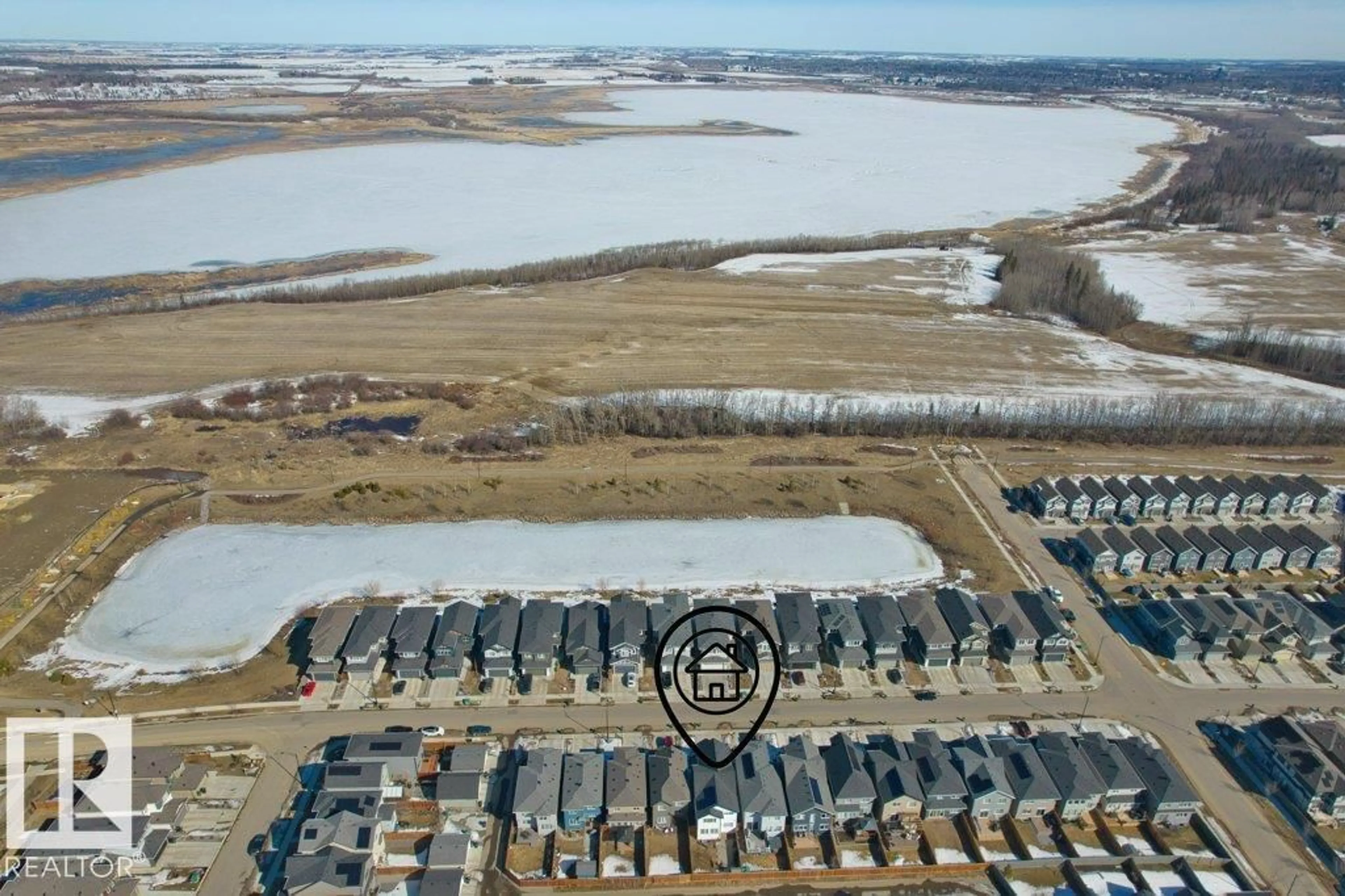 A pic from outside/outdoor area/front of a property/back of a property/a pic from drone, water/lake/river/ocean view for 21003 131 AV, Edmonton Alberta T5S0P4