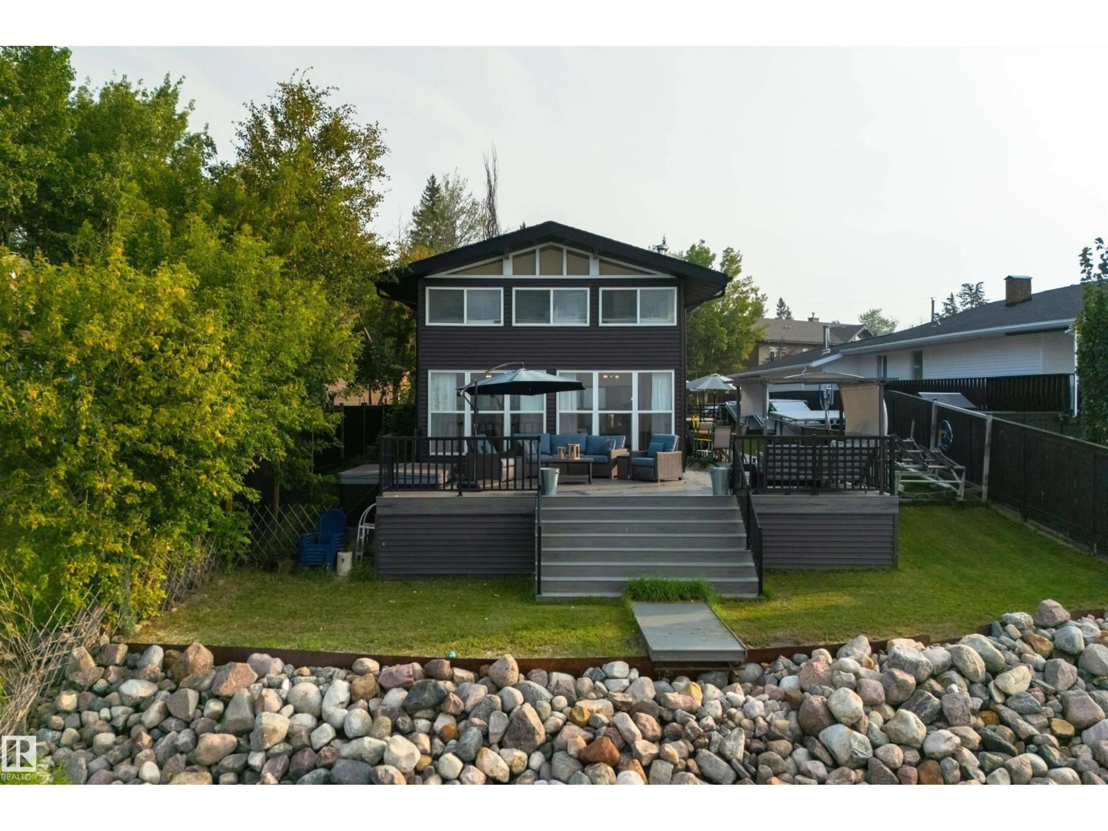 A pic from outside/outdoor area/front of a property/back of a property/a pic from drone, water/lake/river/ocean view for 820 8 ST, Rural Lac Ste. Anne County Alberta T0E1A0