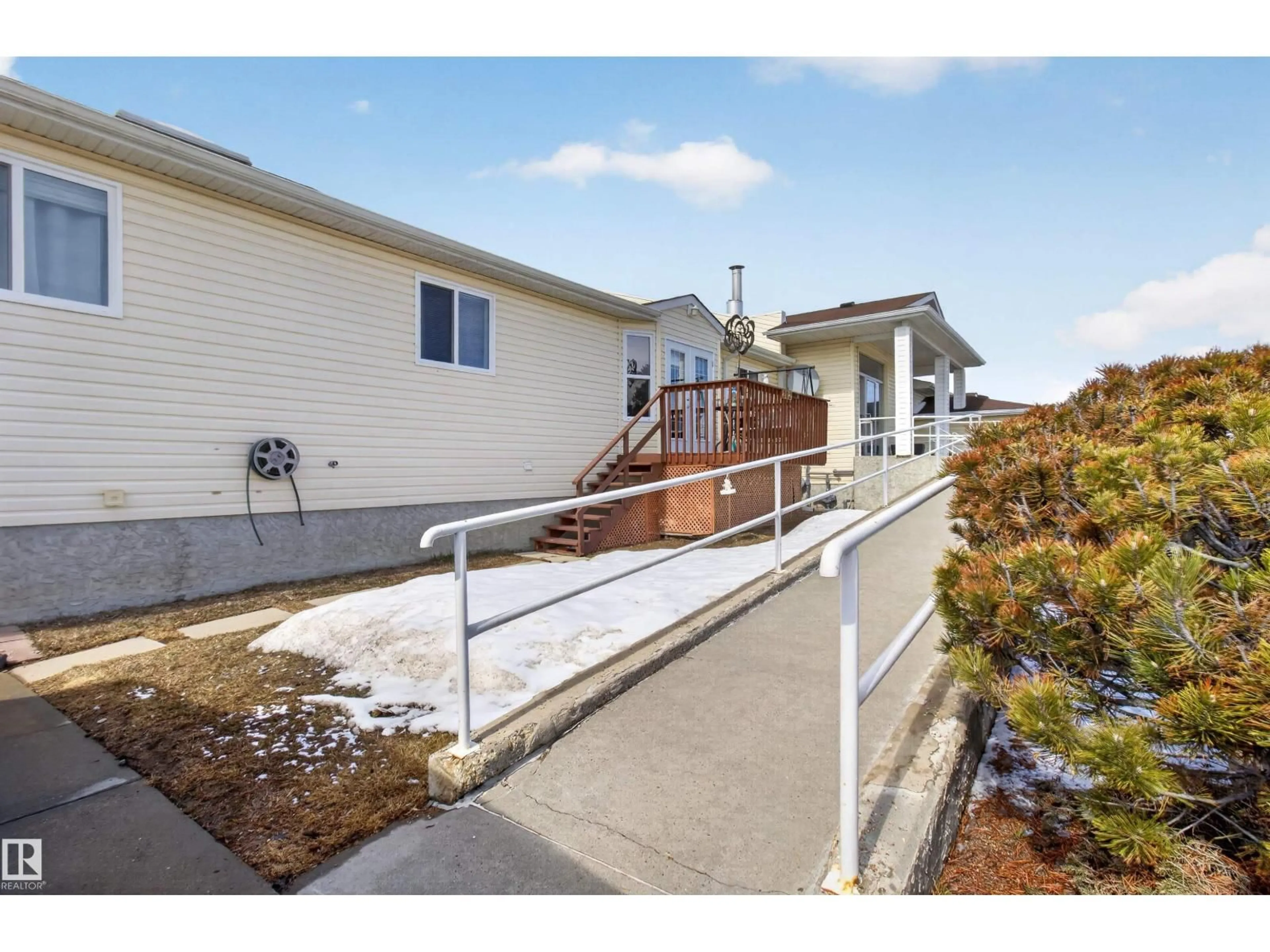 Home with vinyl exterior material, street for 202 - 10502 101 AV, Morinville Alberta T8R1V7