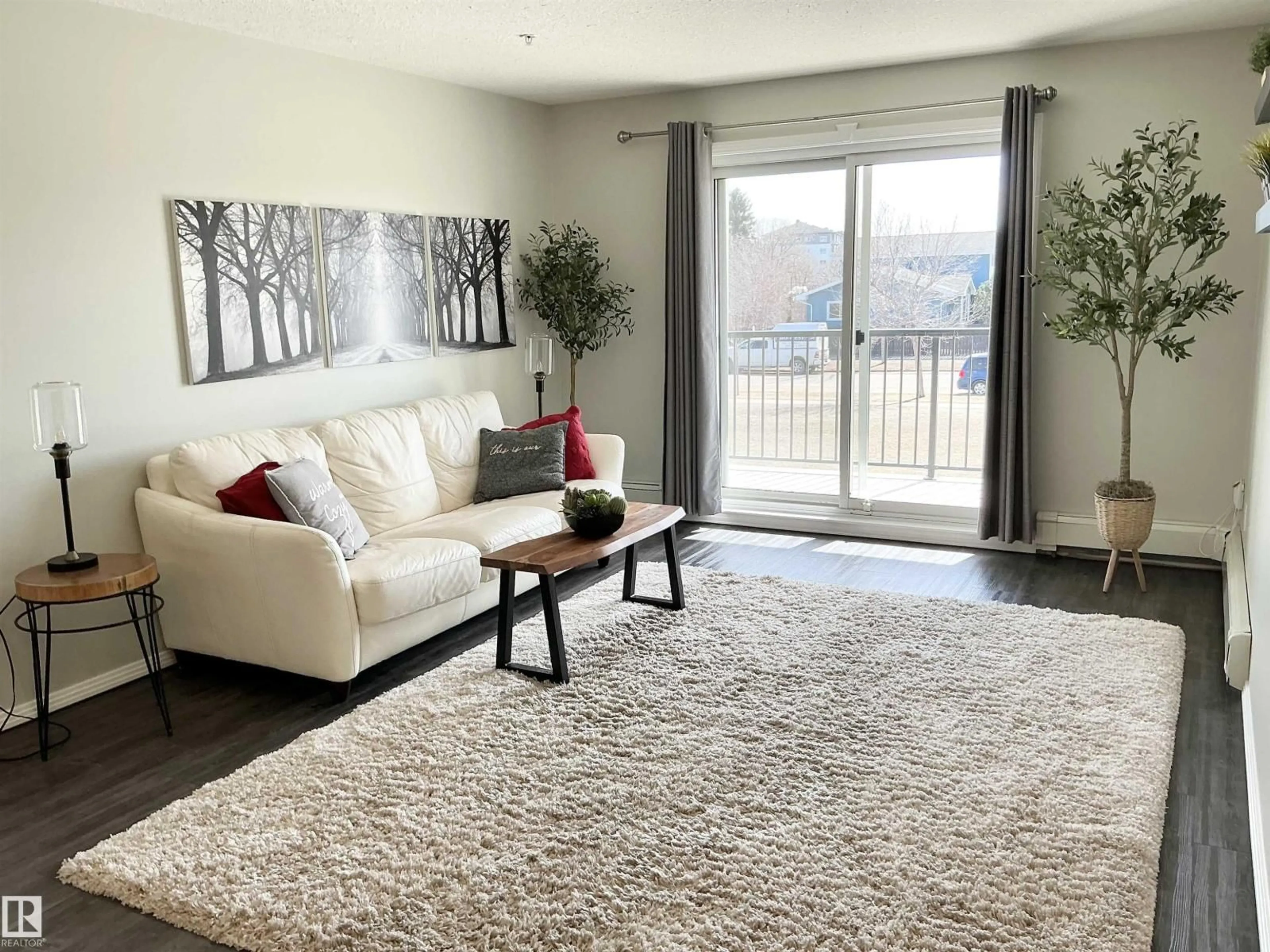 Living room with furniture, unknown for #207 - 592 HOOKE RD, Edmonton Alberta T5A5H2