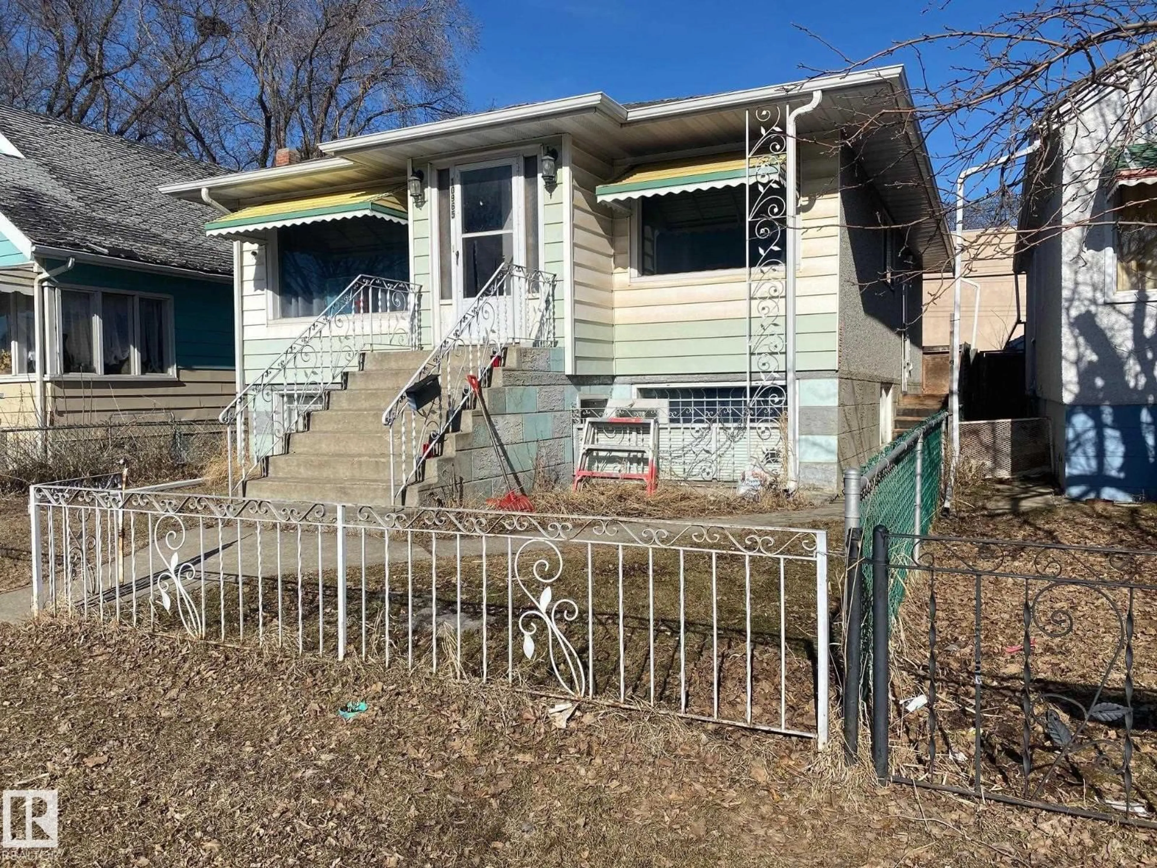 Home with vinyl exterior material, street for 10965 96 ST NW, Edmonton Alberta T5H2K6
