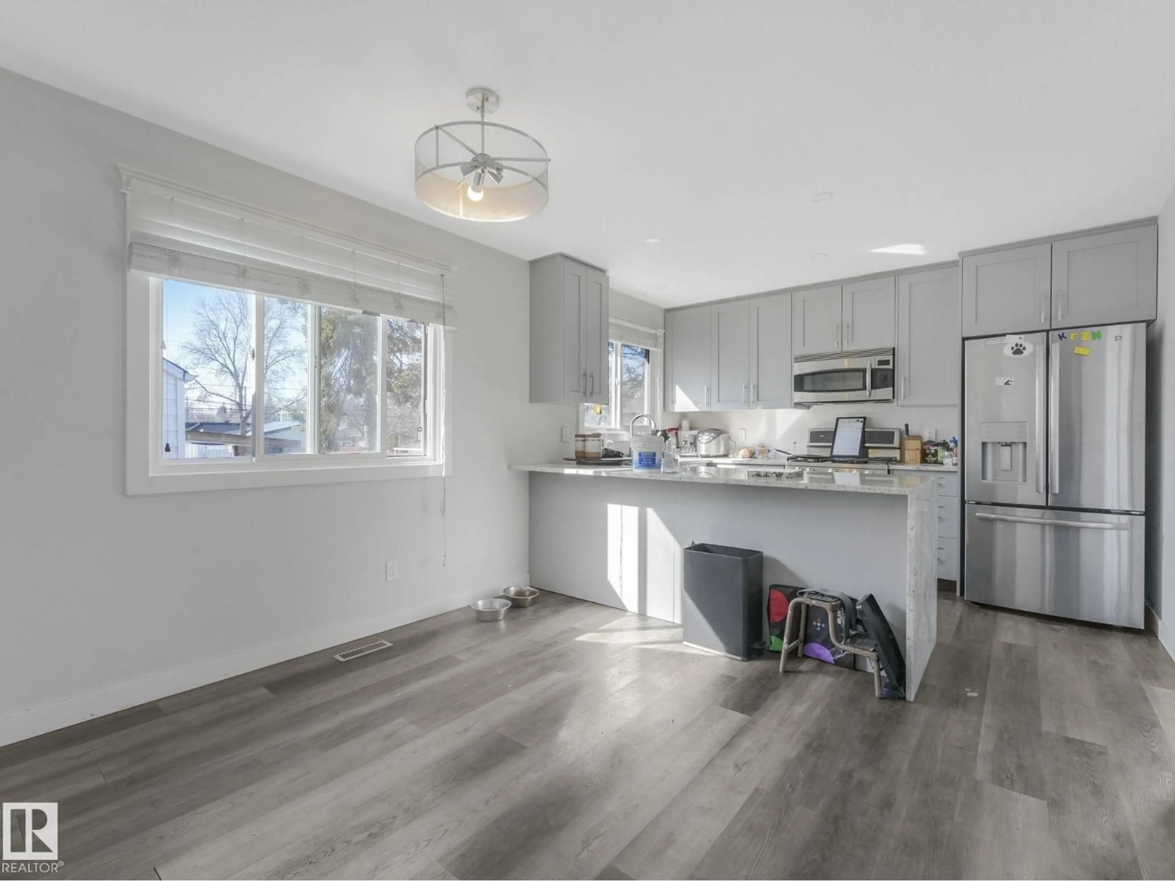 Open concept kitchen, wood/laminate floor for 9714 151 ST, Edmonton Alberta T5P1S7