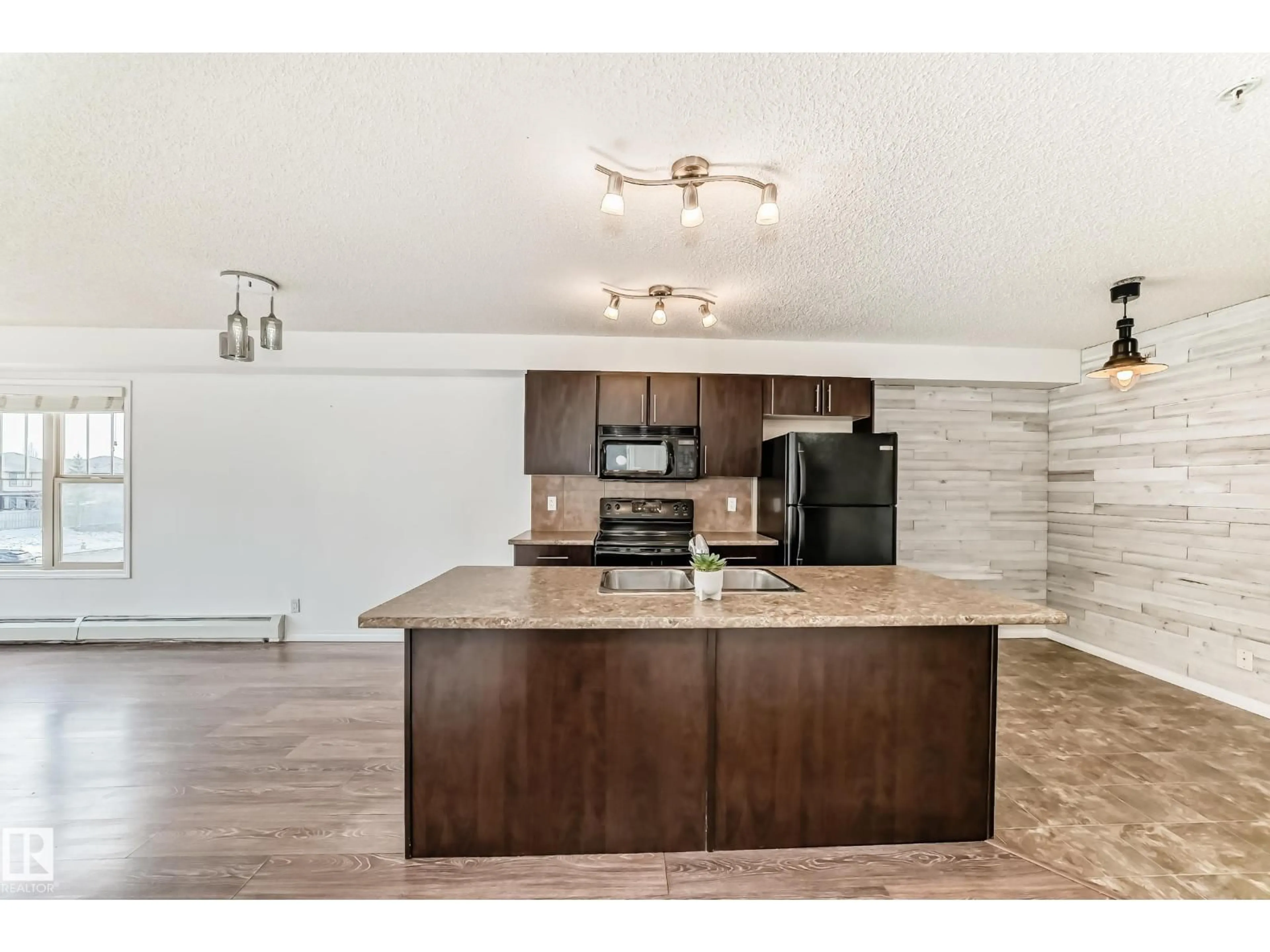 Open concept kitchen, wood/laminate floor for 301 AMBLESIDE DR, Edmonton Alberta T6W0J4