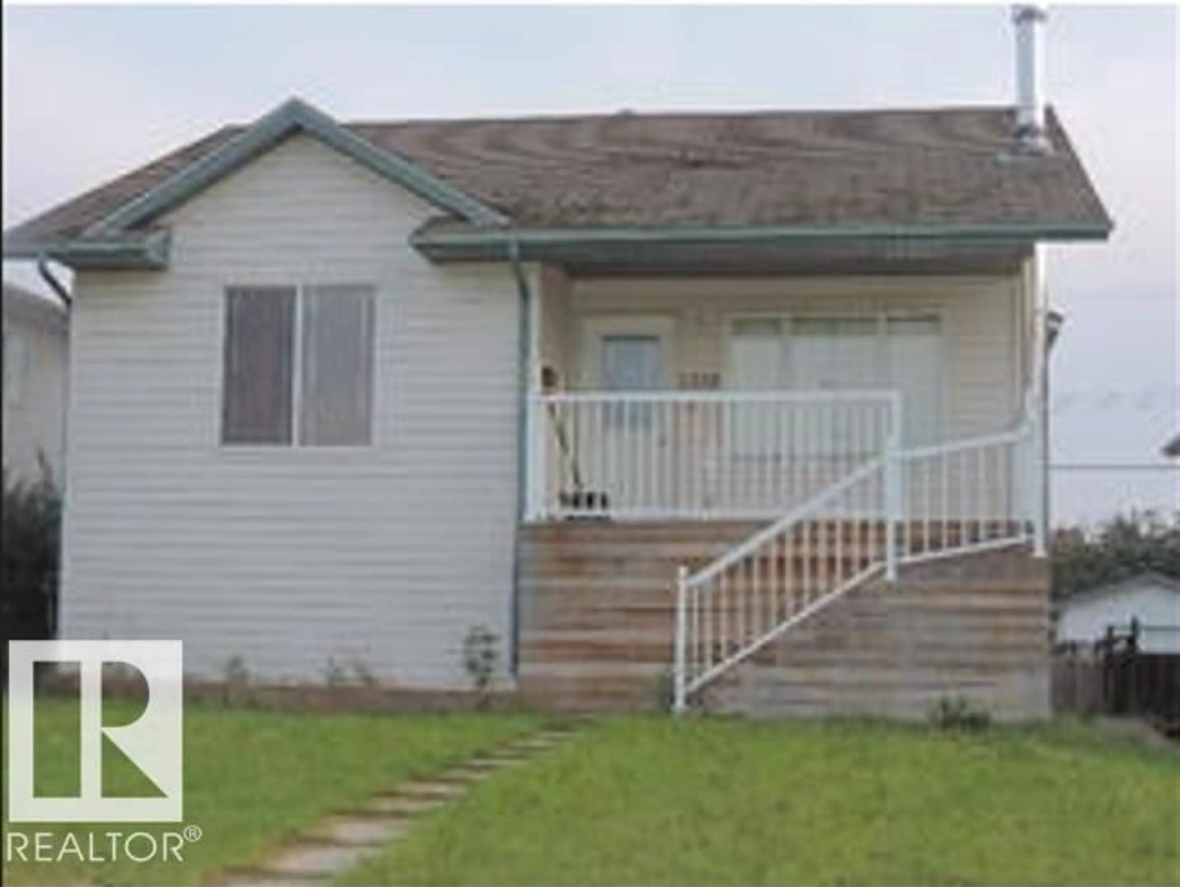 Home with vinyl exterior material, street for 1318 8 AV, Cold Lake Alberta T9M1N6