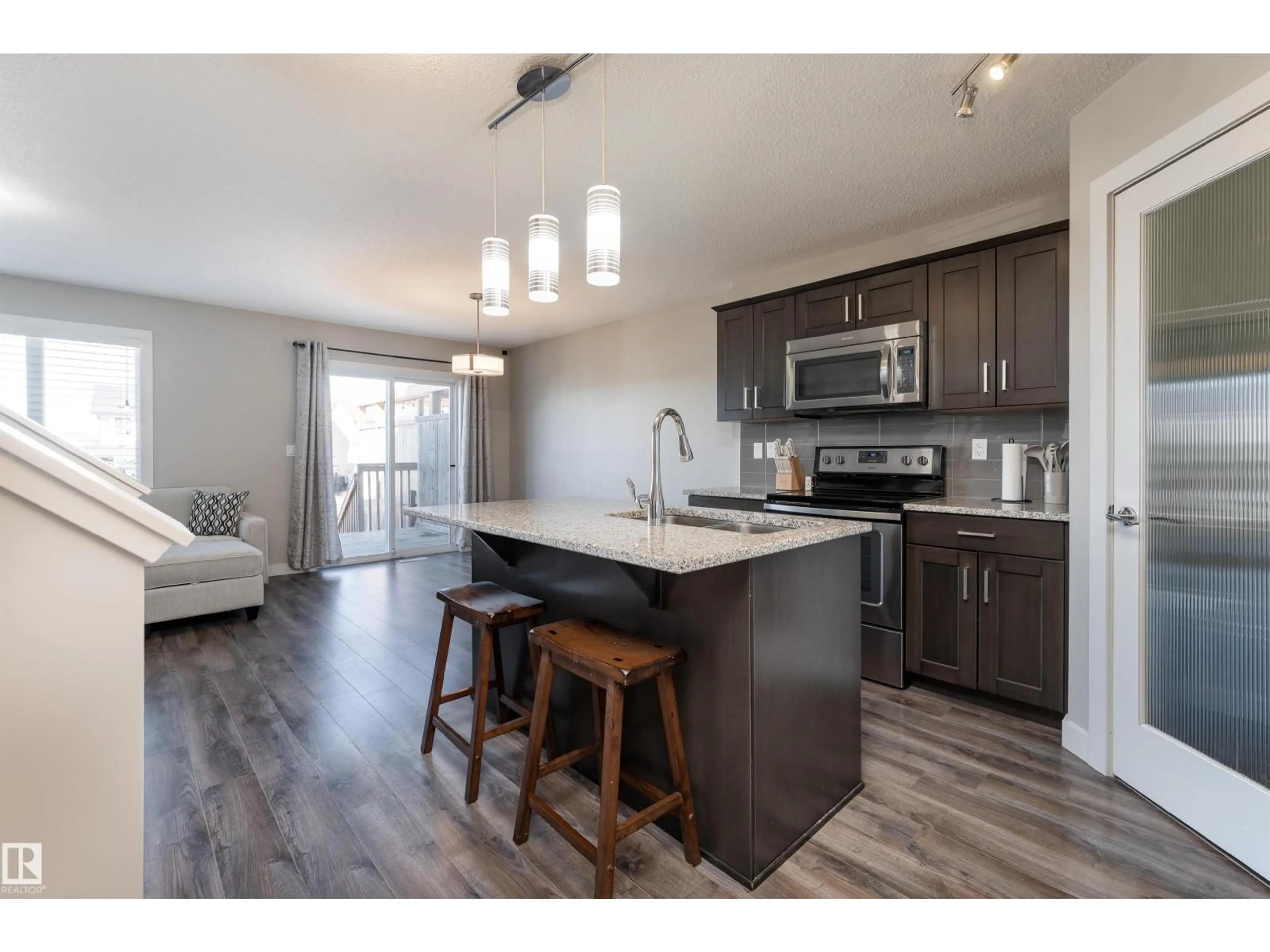 Open concept kitchen, wood/laminate floor for 1 HAMMETT GA, Spruce Grove Alberta T7X0V2