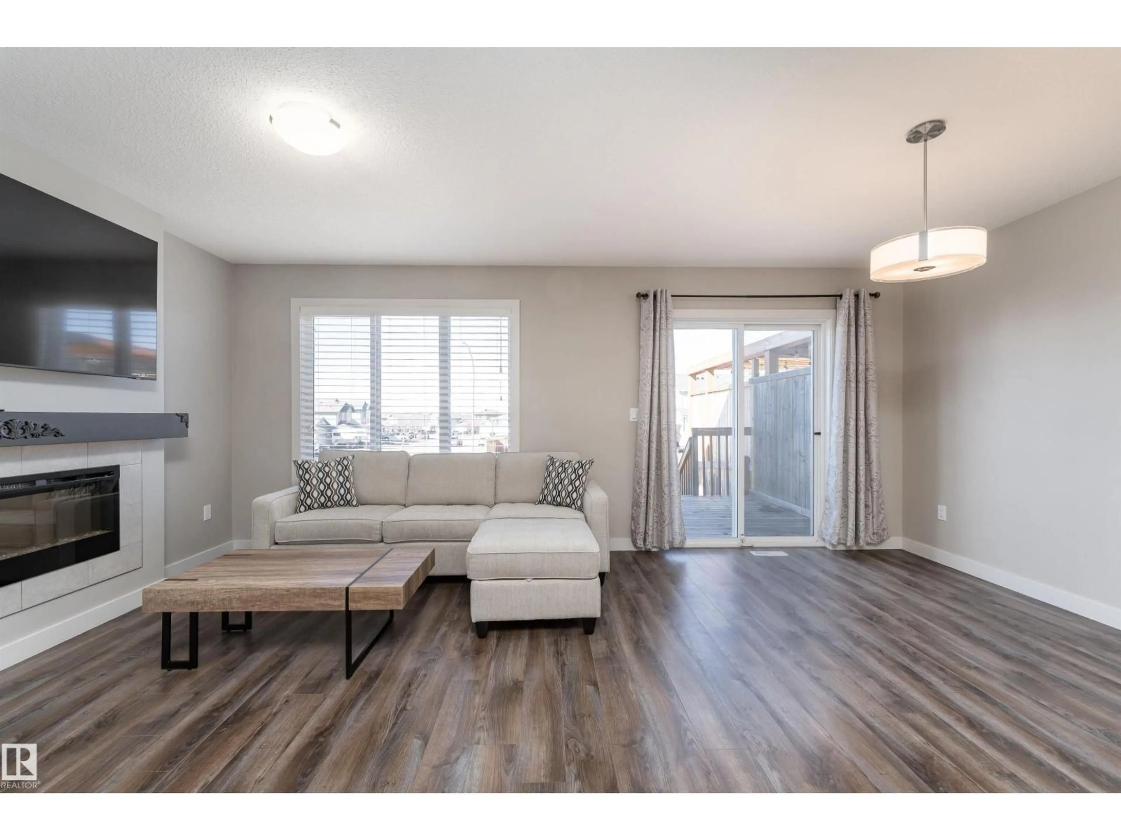 Living room with furniture, wood/laminate floor for 1 HAMMETT GA, Spruce Grove Alberta T7X0V2