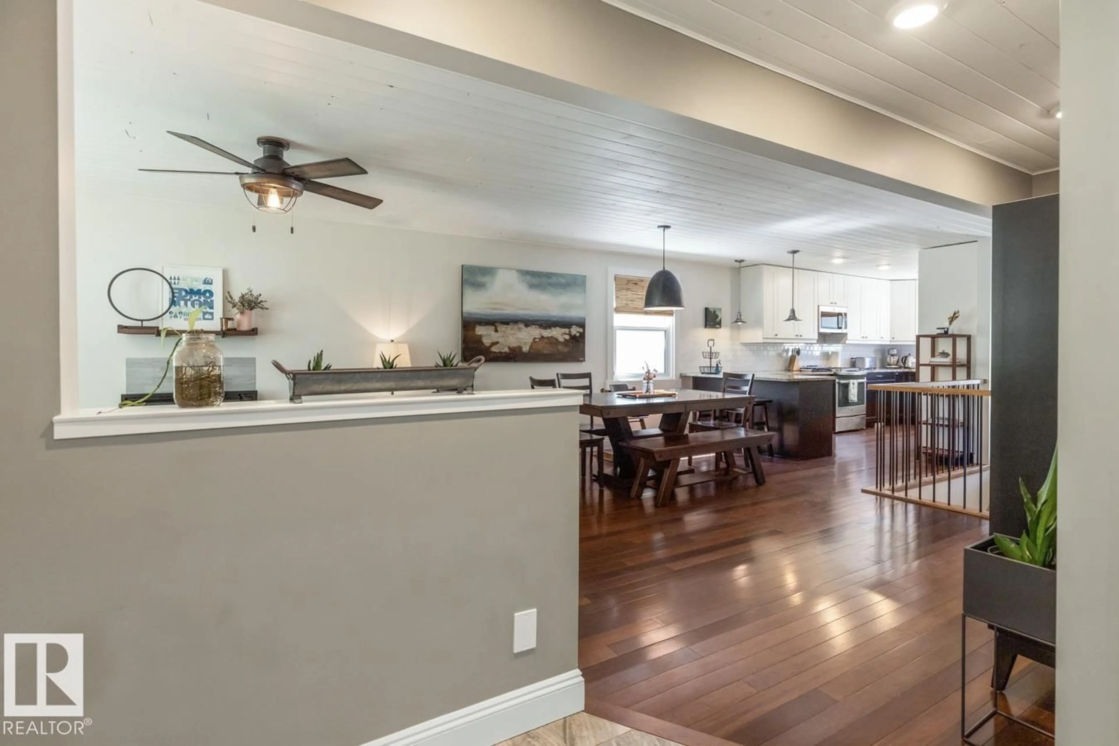 Open concept kitchen, wood/laminate floor for 9328 94 ST, Edmonton Alberta T6C3V7