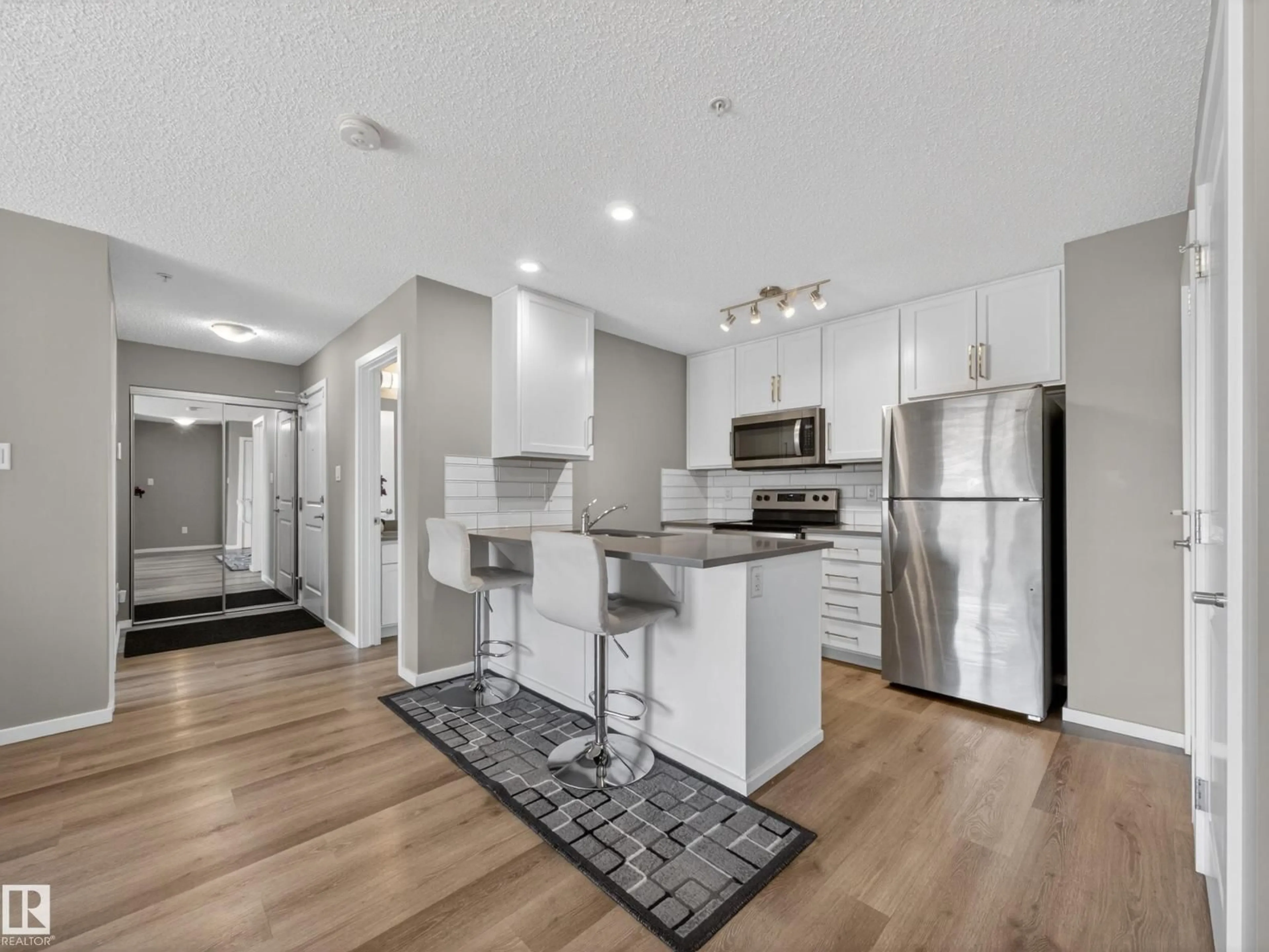 Open concept kitchen, unknown for 148 - 124 EBBERS BV, Edmonton Alberta T5Y4A4