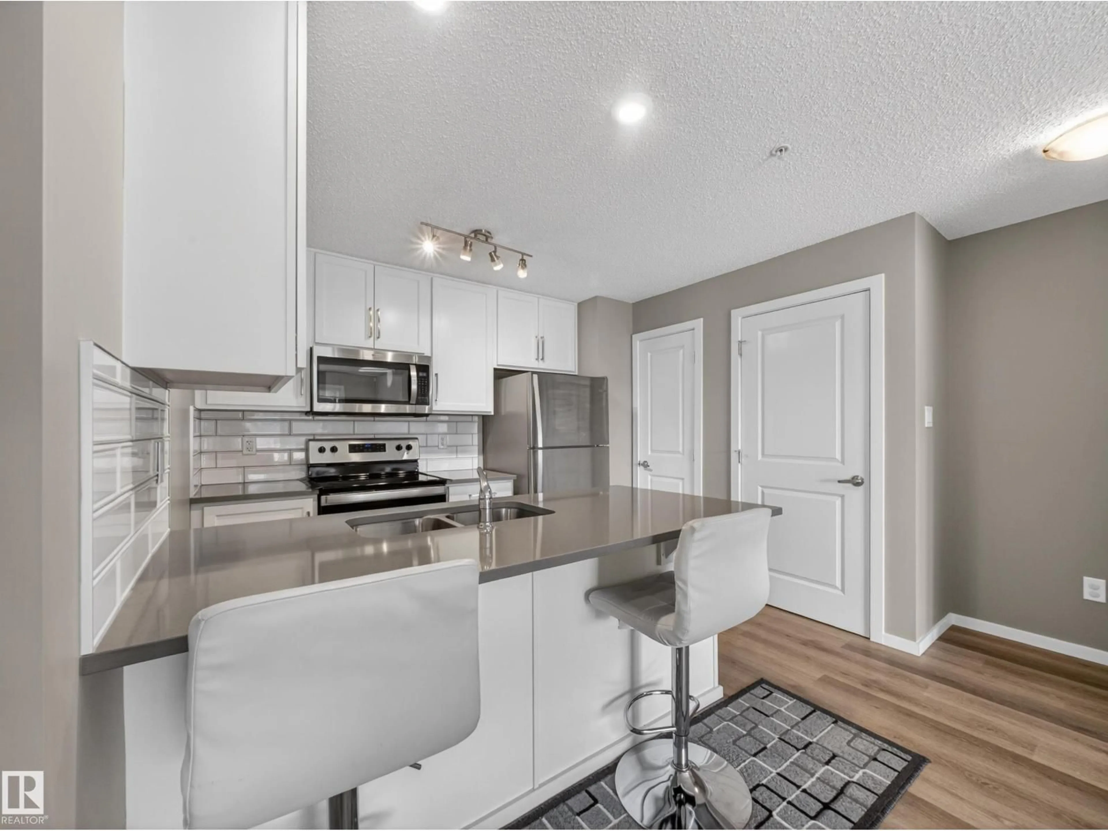 Open concept kitchen, unknown for 148 - 124 EBBERS BV, Edmonton Alberta T5Y4A4