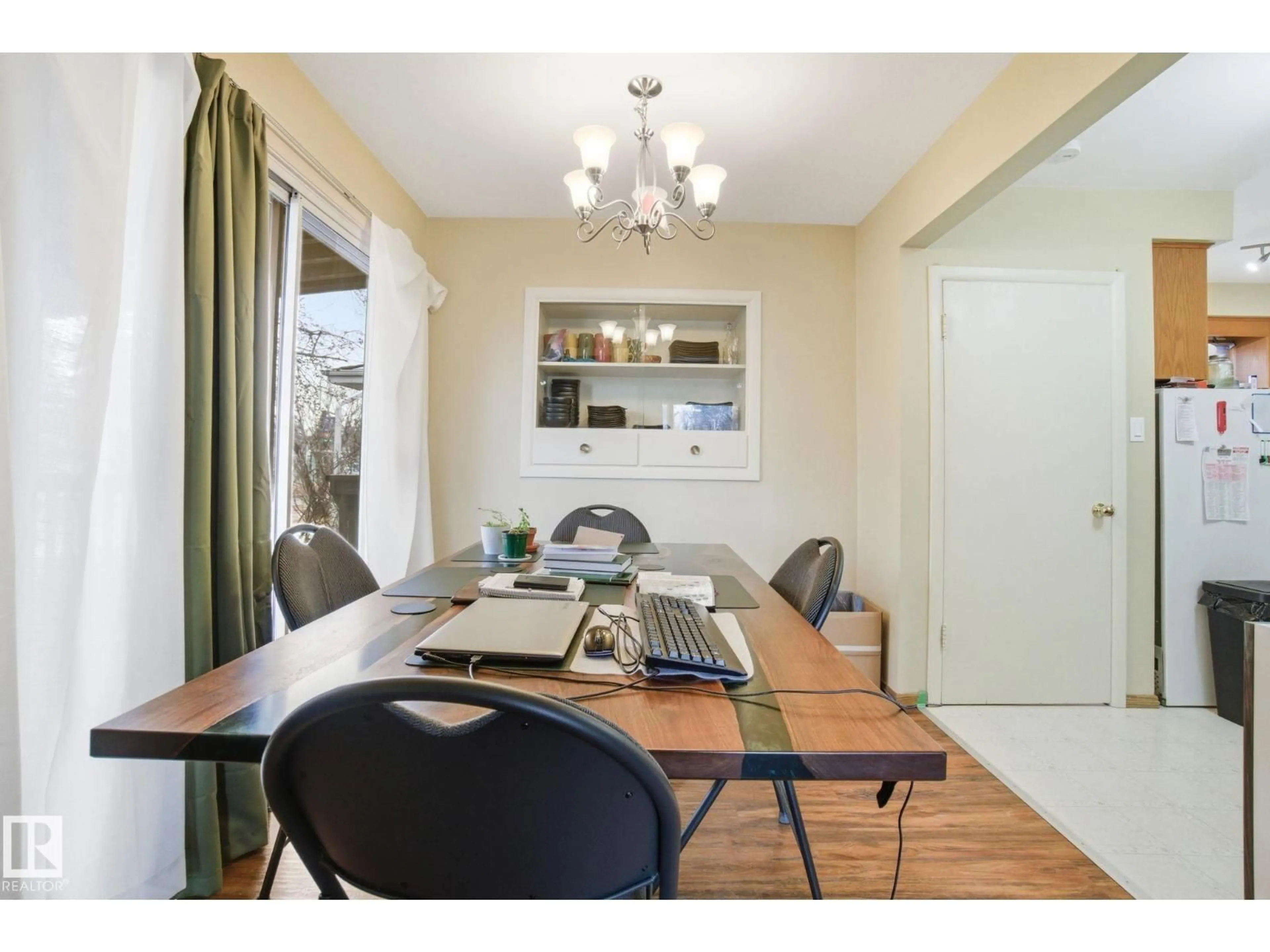 Dining room, wood/laminate floor for 8208 73 AV, Edmonton Alberta T6C0C9