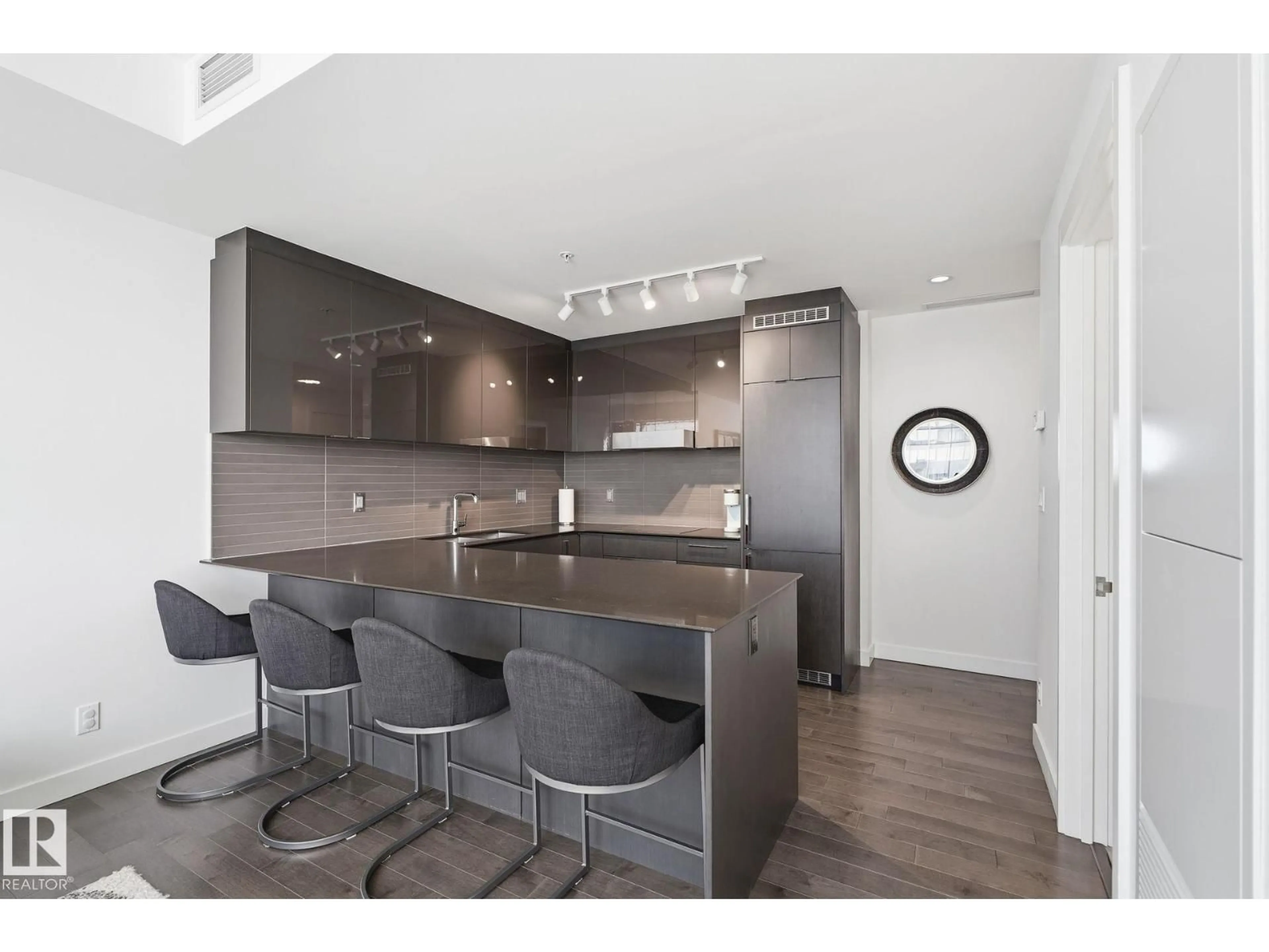 Open concept kitchen, wood/laminate floor for 3308 10360 102 ST NW, Edmonton Alberta T6J0G7