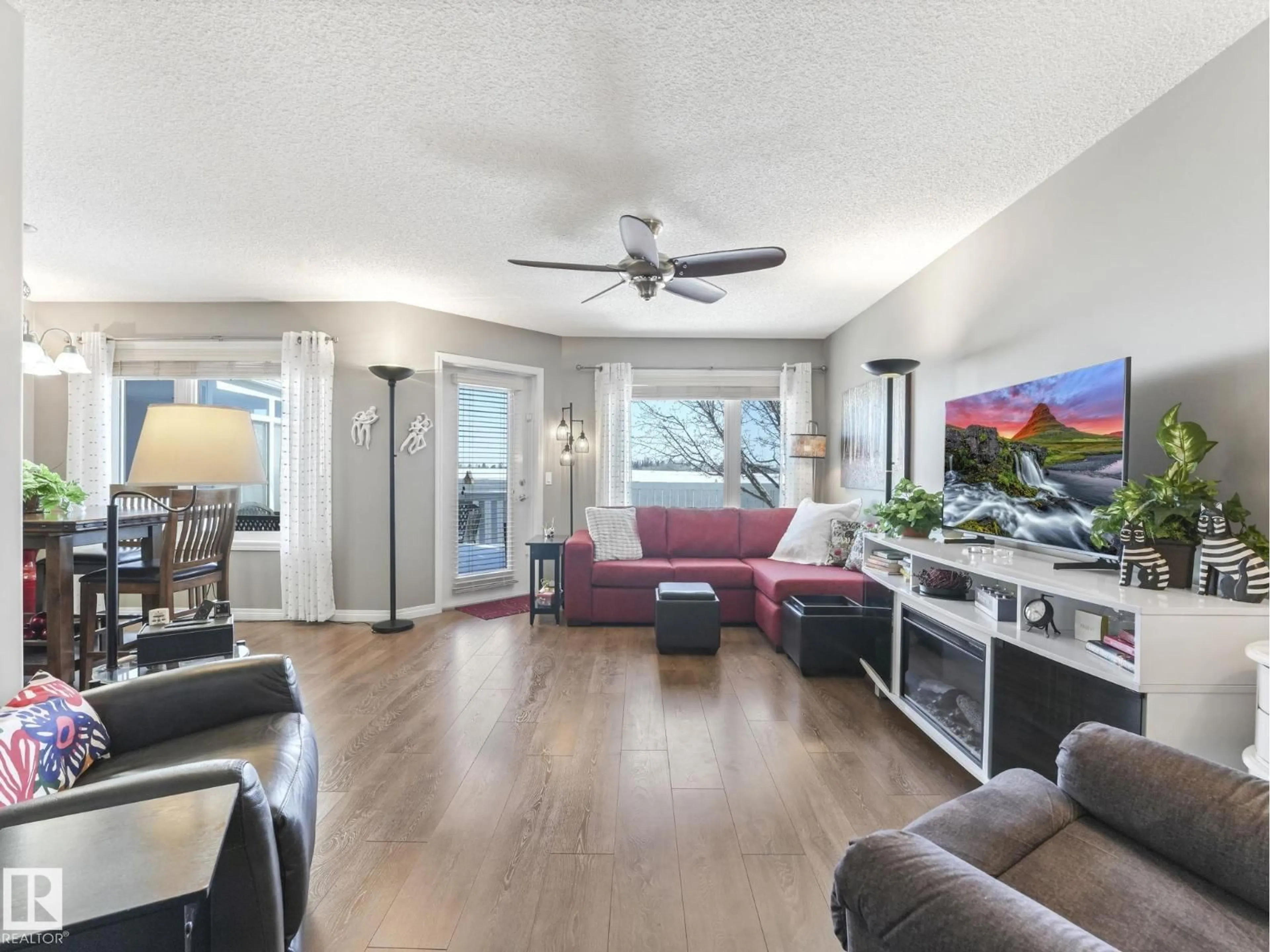 Living room with furniture, wood/laminate floor for #2 - 160 KINGSWOOD BV, St. Albert Alberta T8N6Z6