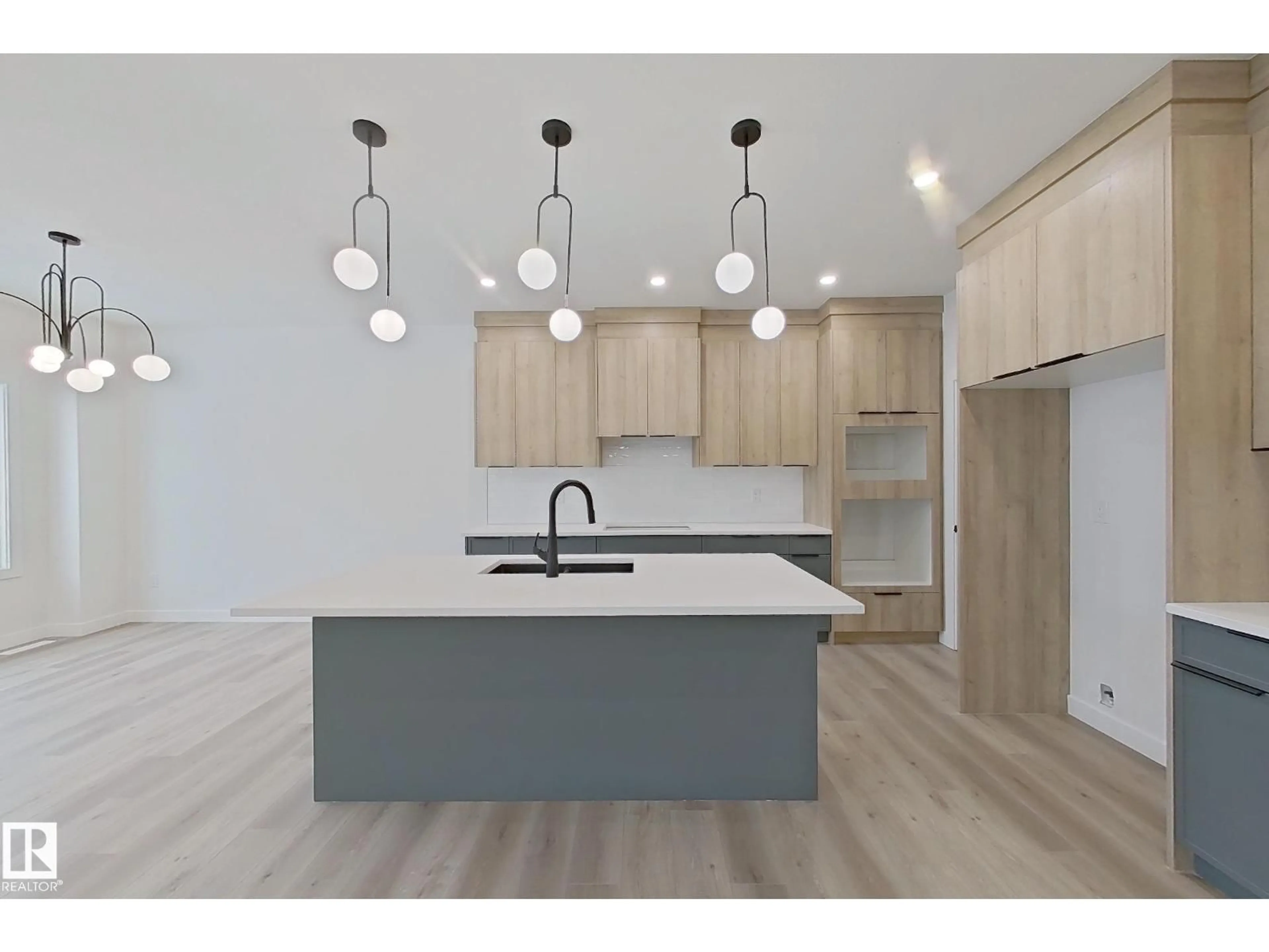 Open concept kitchen, wood/laminate floor for 3158 MAGPIE WAY, Edmonton Alberta T5S0K8