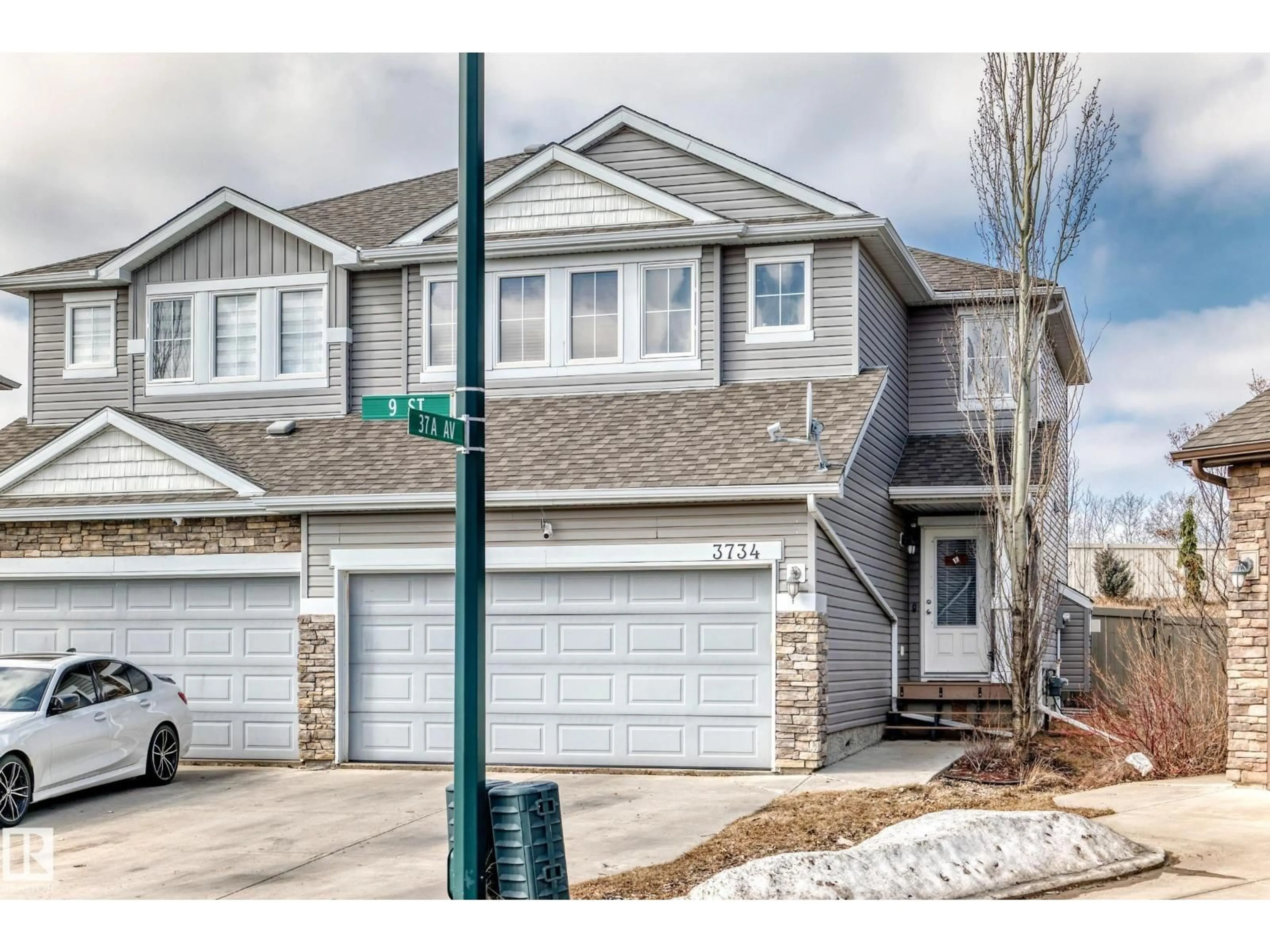 Home with vinyl exterior material, street for NW - 3734 9 ST, Edmonton Alberta T6T0S2